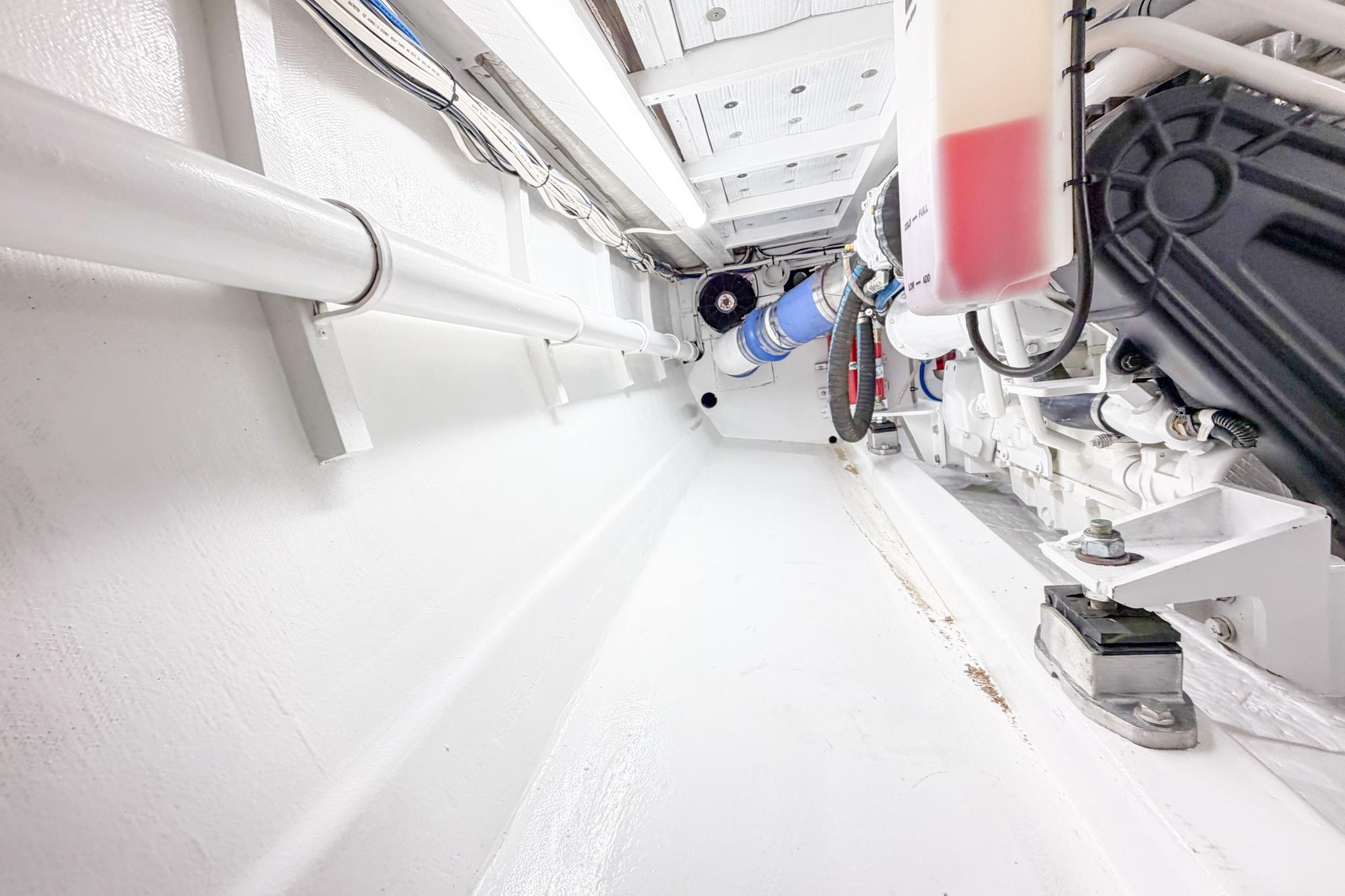 Engine room of 1998 Blackwell Custom Carolina Sportfish, showcasing clean, organized mechanical components.