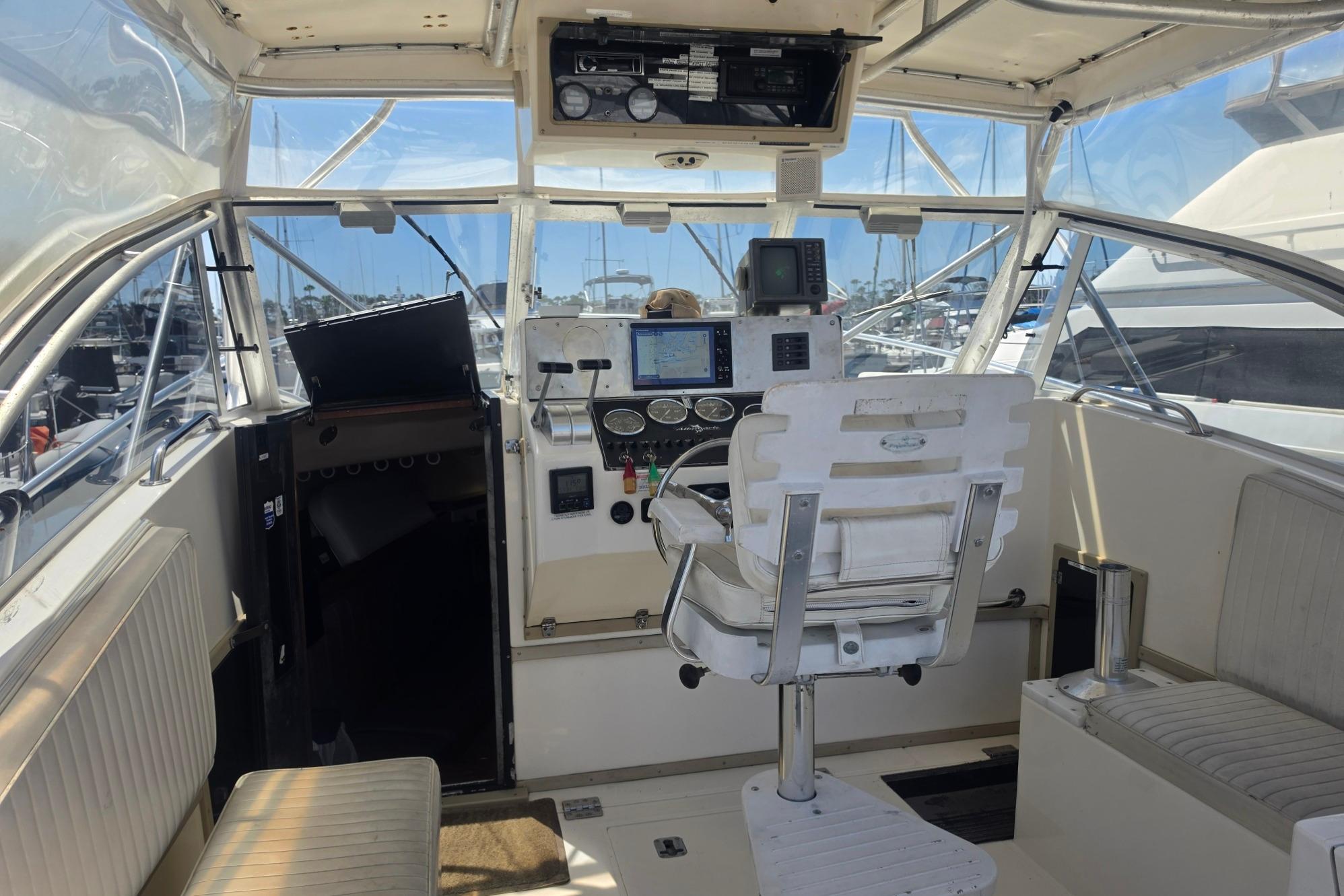 1999 Albemarle 305 Express Fisherman cockpit with navigation equipment and seating.