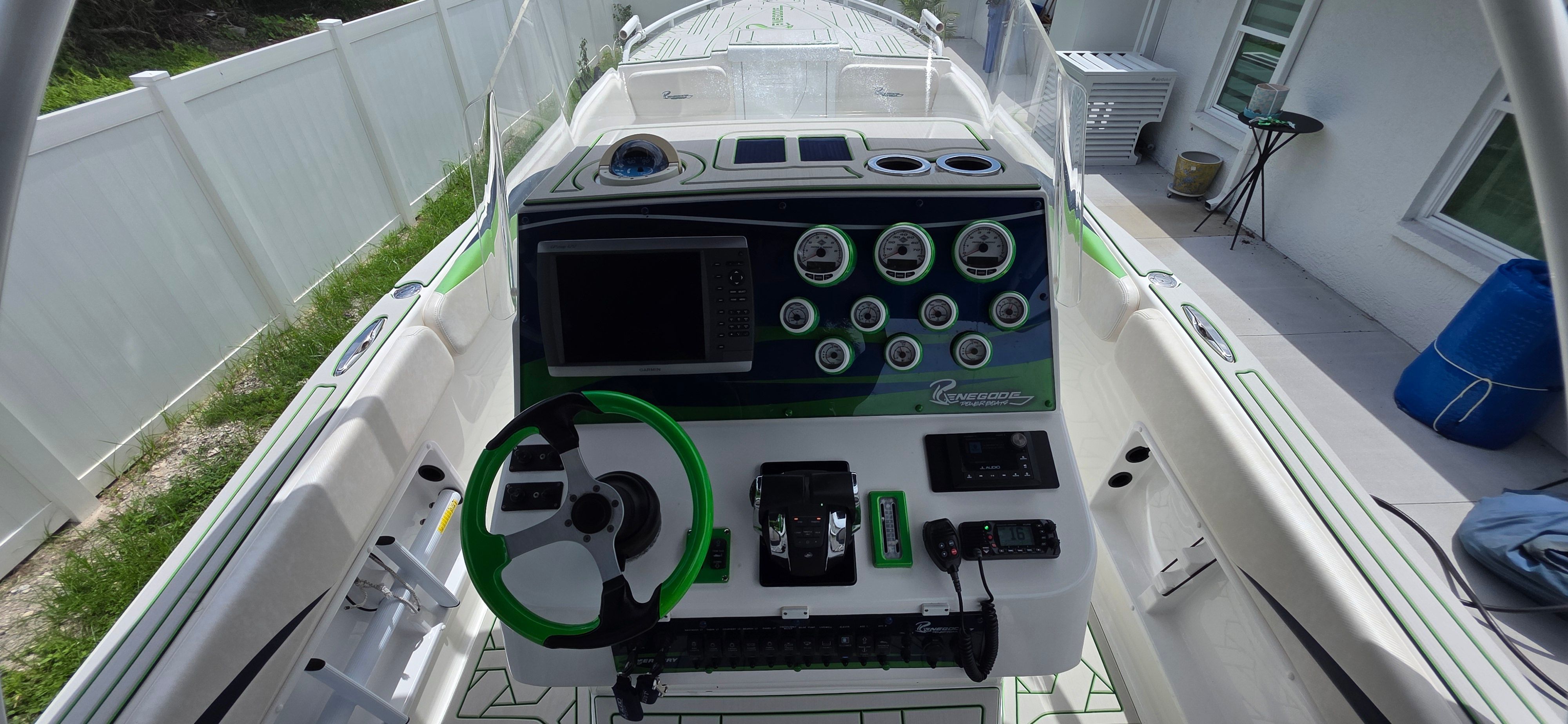 2013 Renegade 32 FT boat cockpit with controls and instruments.