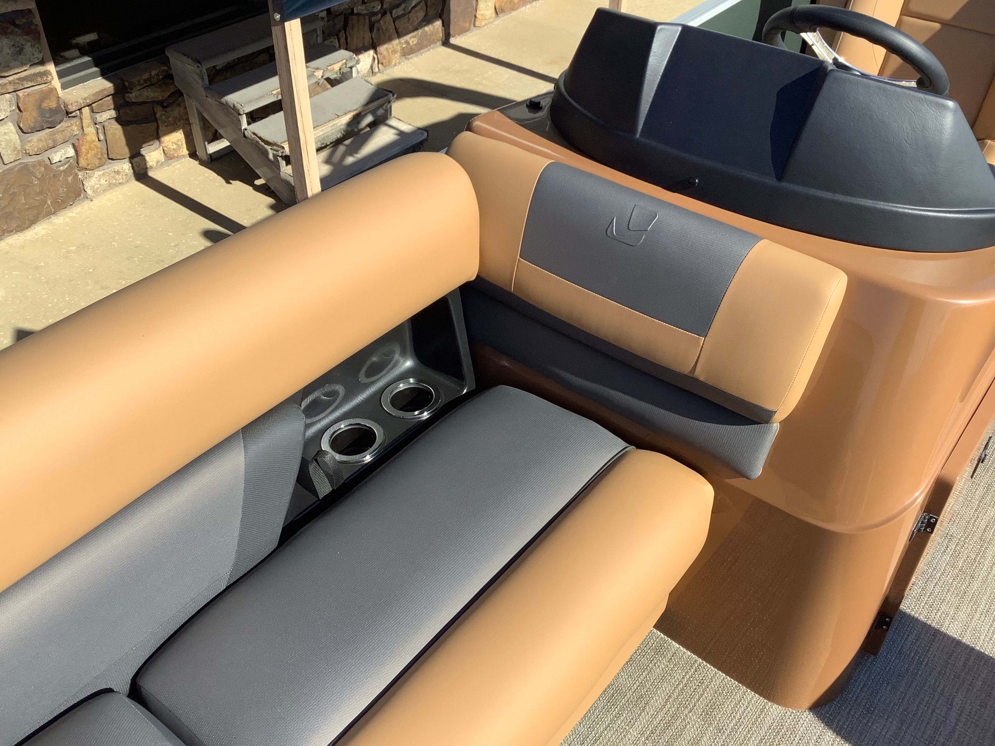 Interior of 2026 Landau 21 Island Breeze with beige and gray seating.