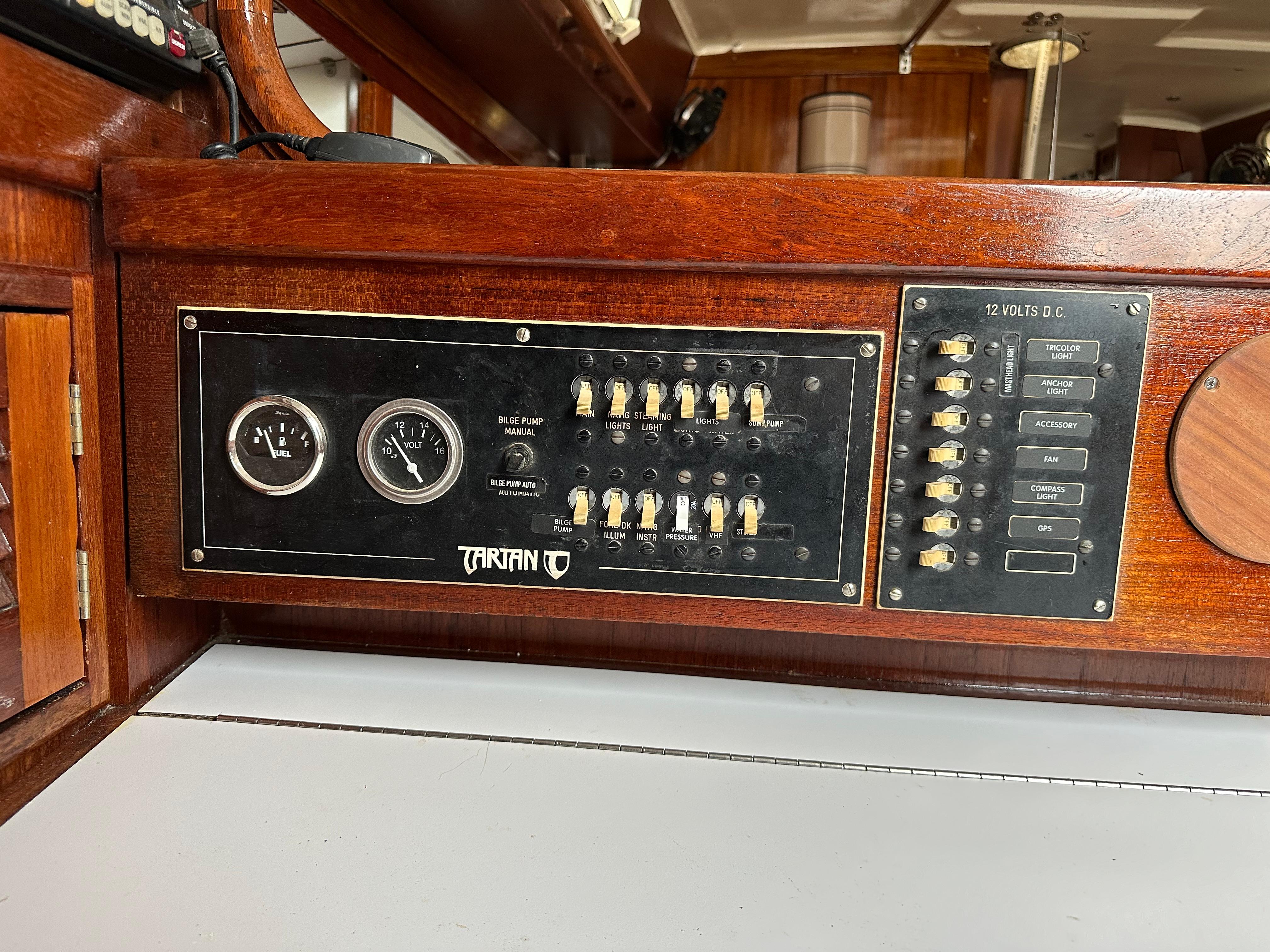 Control panel of a 1981 Tartan 37 sloop, featuring gauges and switches.