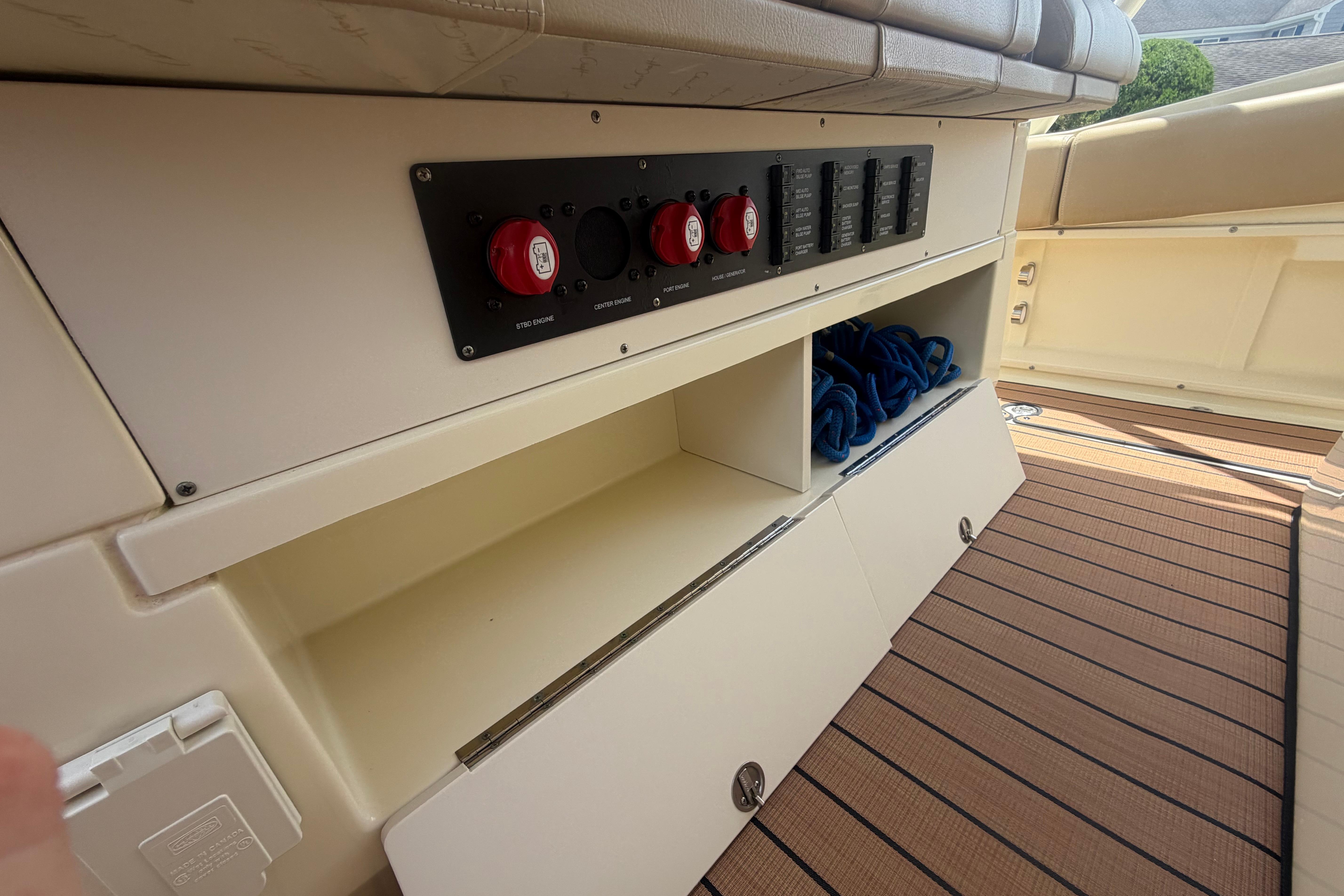 2017 Chris-Craft Catalina 34 boat interior with control panel and storage compartments.