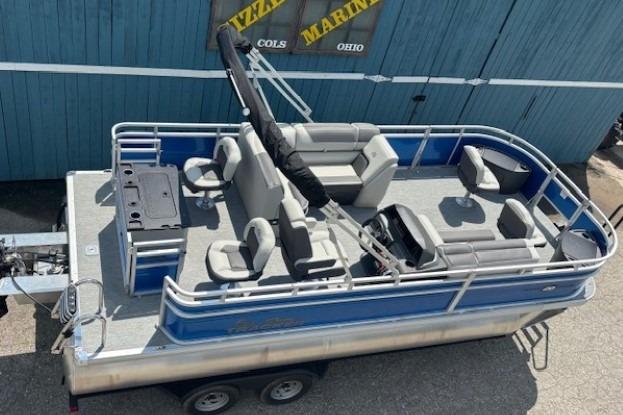 2026 Sun Tracker Fishin' Barge 20 DLX pontoon boat with spacious seating and fishing amenities.
