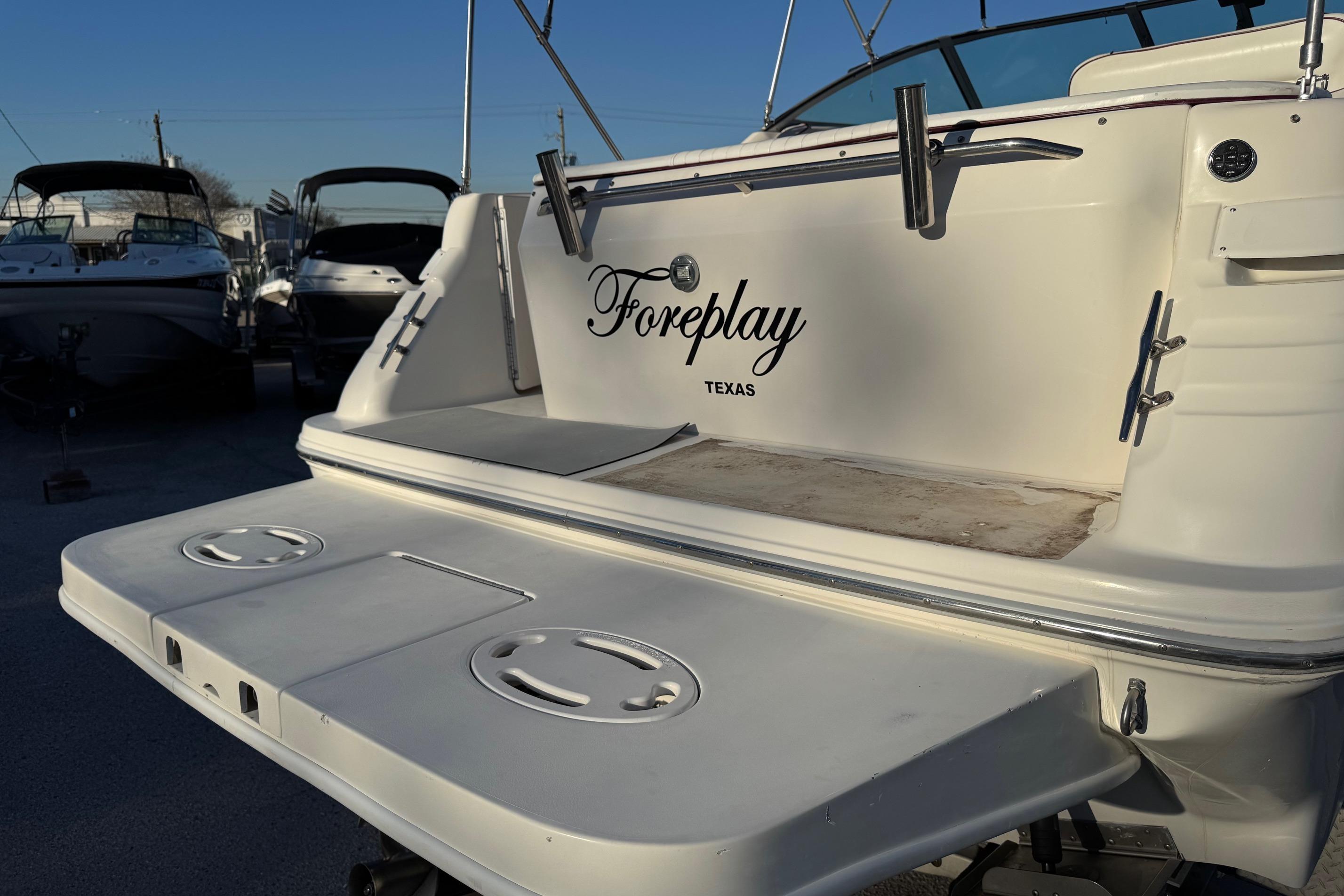 1994 Sea Ray 270 Sundancer boat with "Foreplay" name, docked in Texas.
