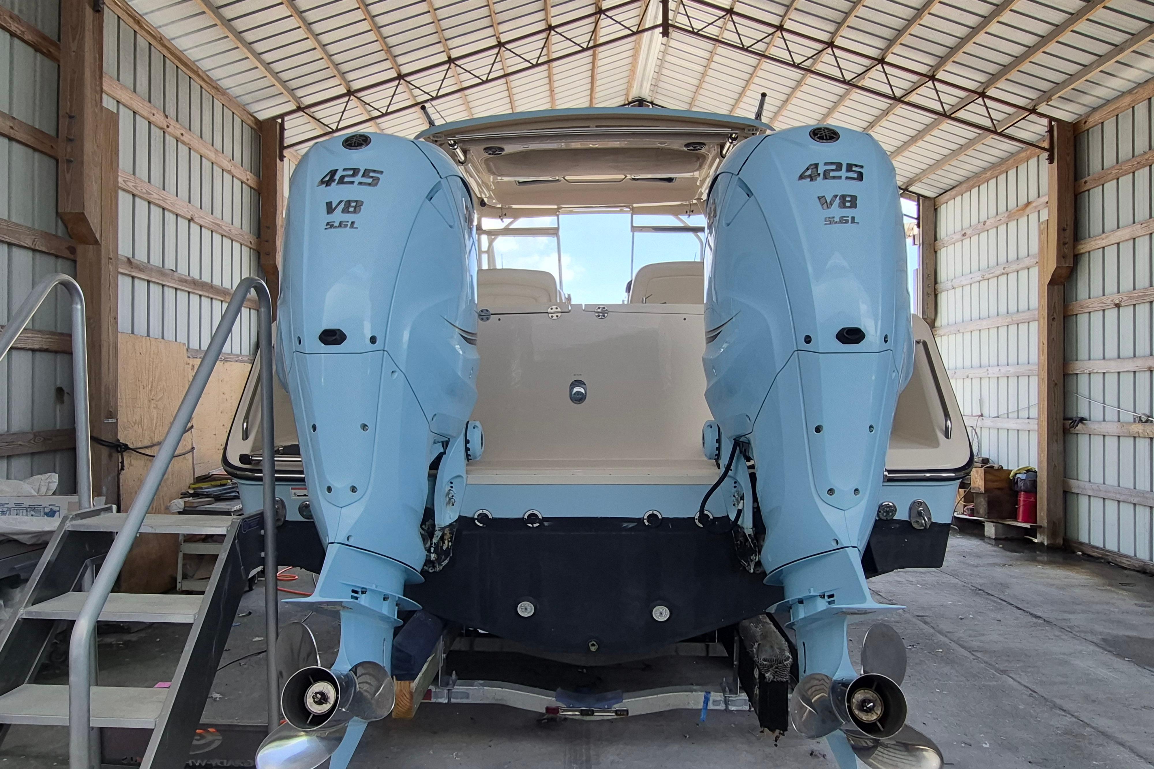 2019 Grady-White Freedom 335 boat with twin 425 V8 engines in a covered storage.