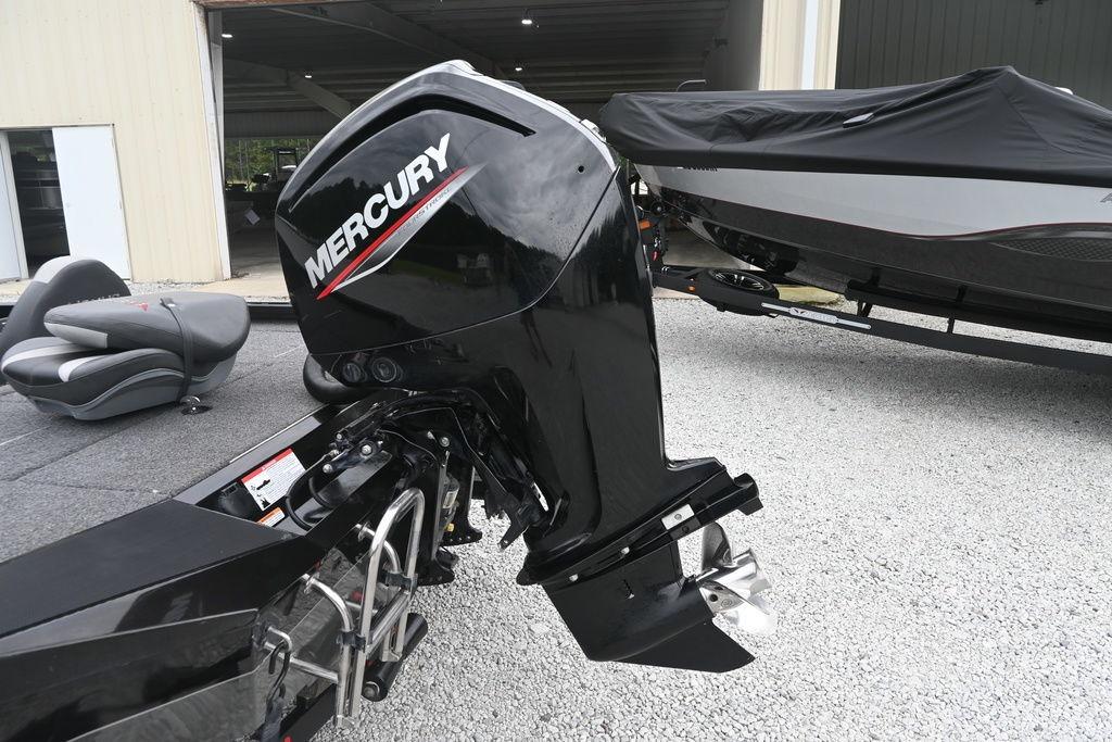 2022 Vexus AVX181 boat with Mercury outboard motor in a garage setting.