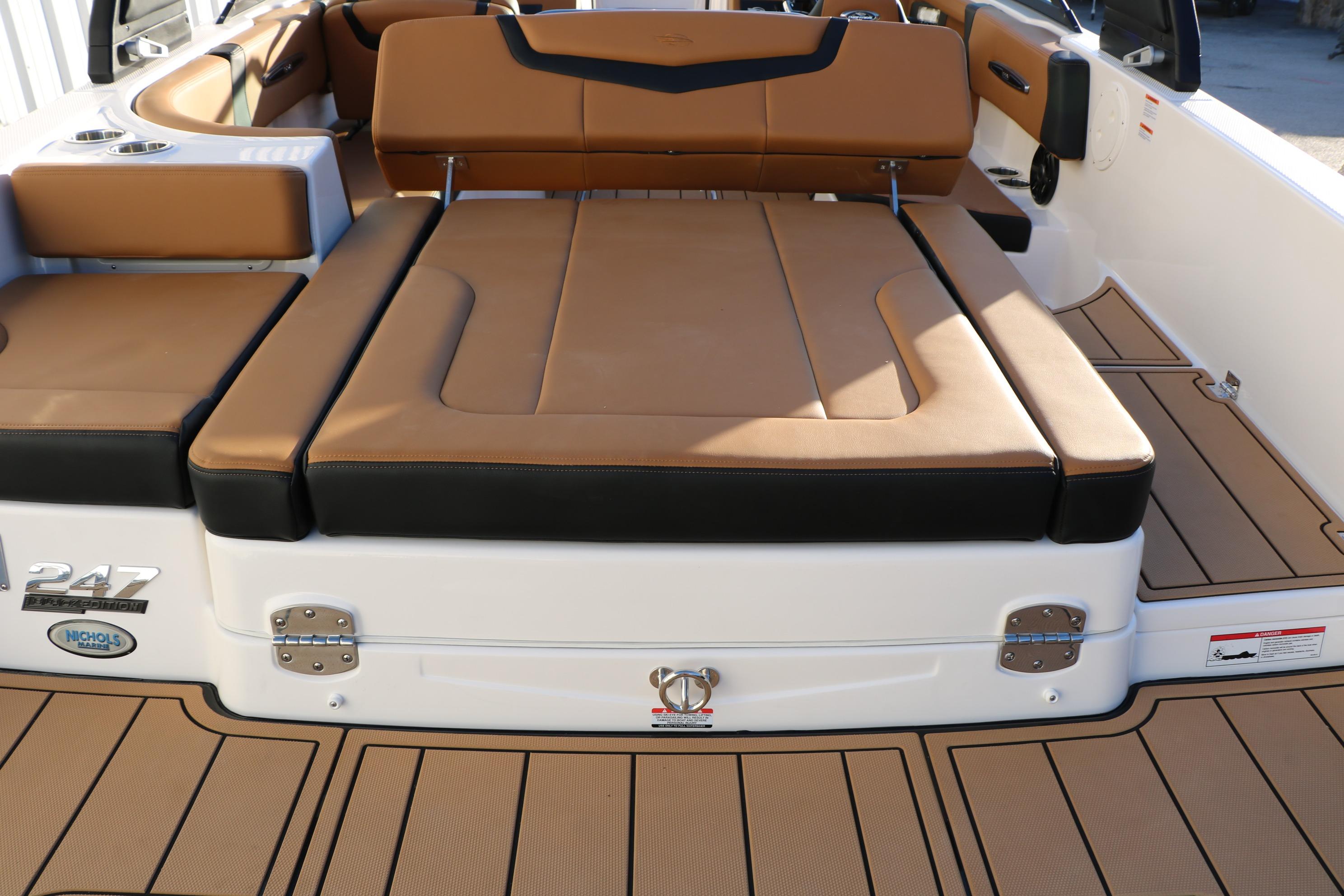 2026 Chaparral 247 SSX boat interior with tan and black seating.