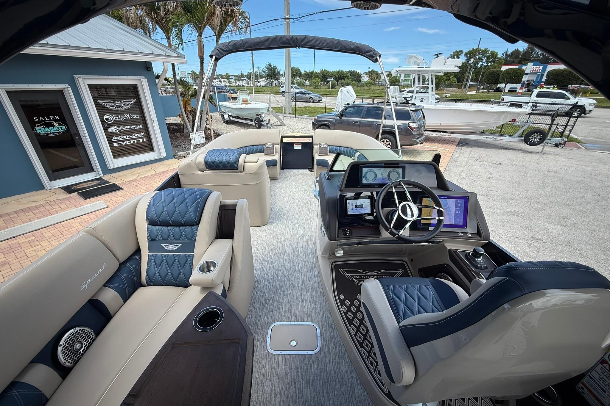 Interior of 2026 Bennington 27 QSBAT2 pontoon boat with luxurious seating and modern helm.