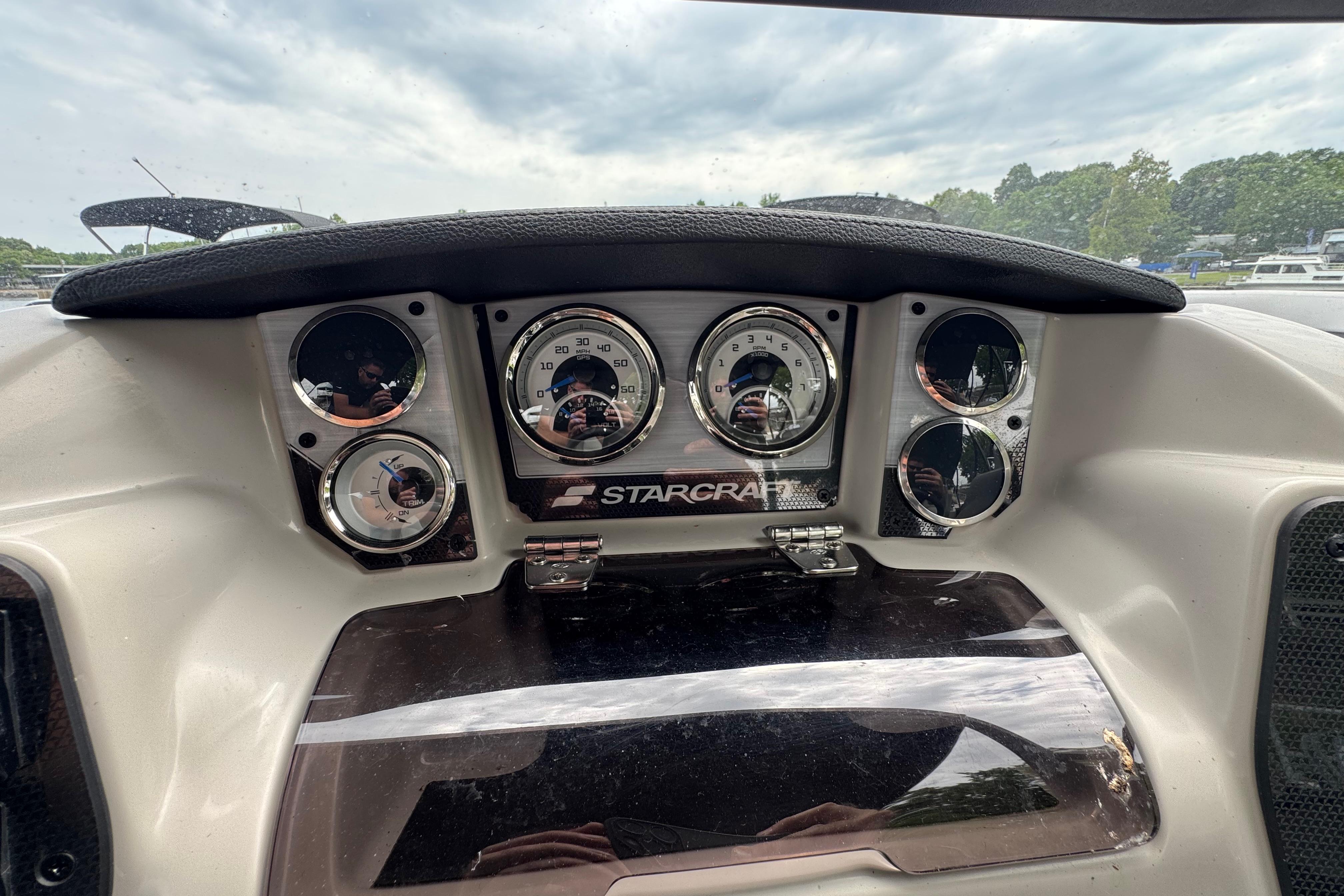 Dashboard of 2023 Starcraft MX 25 DL DH boat with gauges and controls.