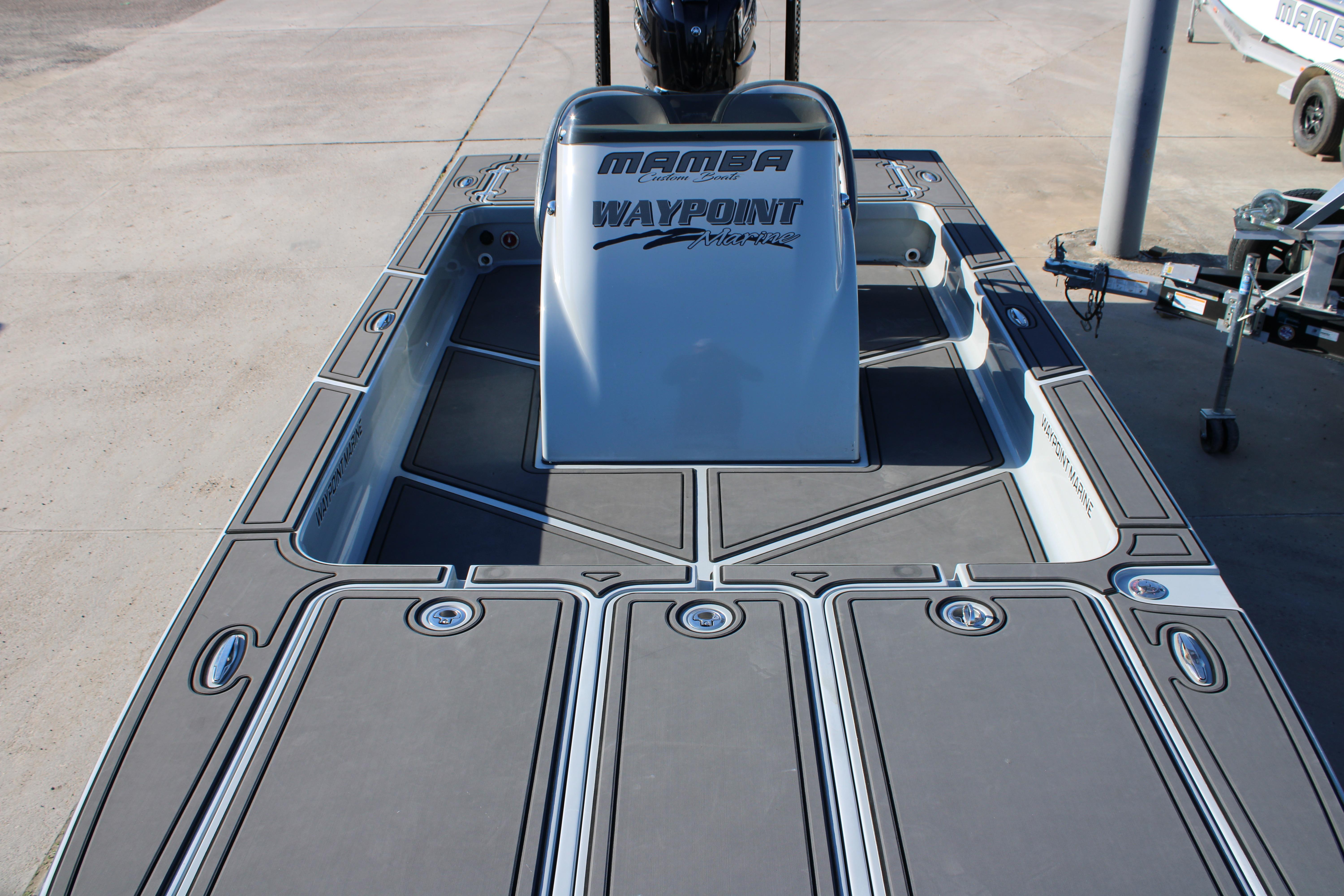 2025 Mamba 227VX boat deck with Waypoint Marine branding, featuring sleek design and storage compartments.