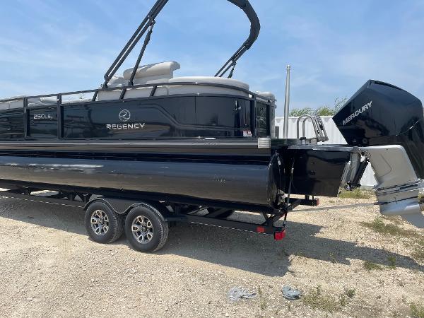 2023 Regency 250 LE3 pontoon boat on trailer, featuring a Mercury outboard motor.