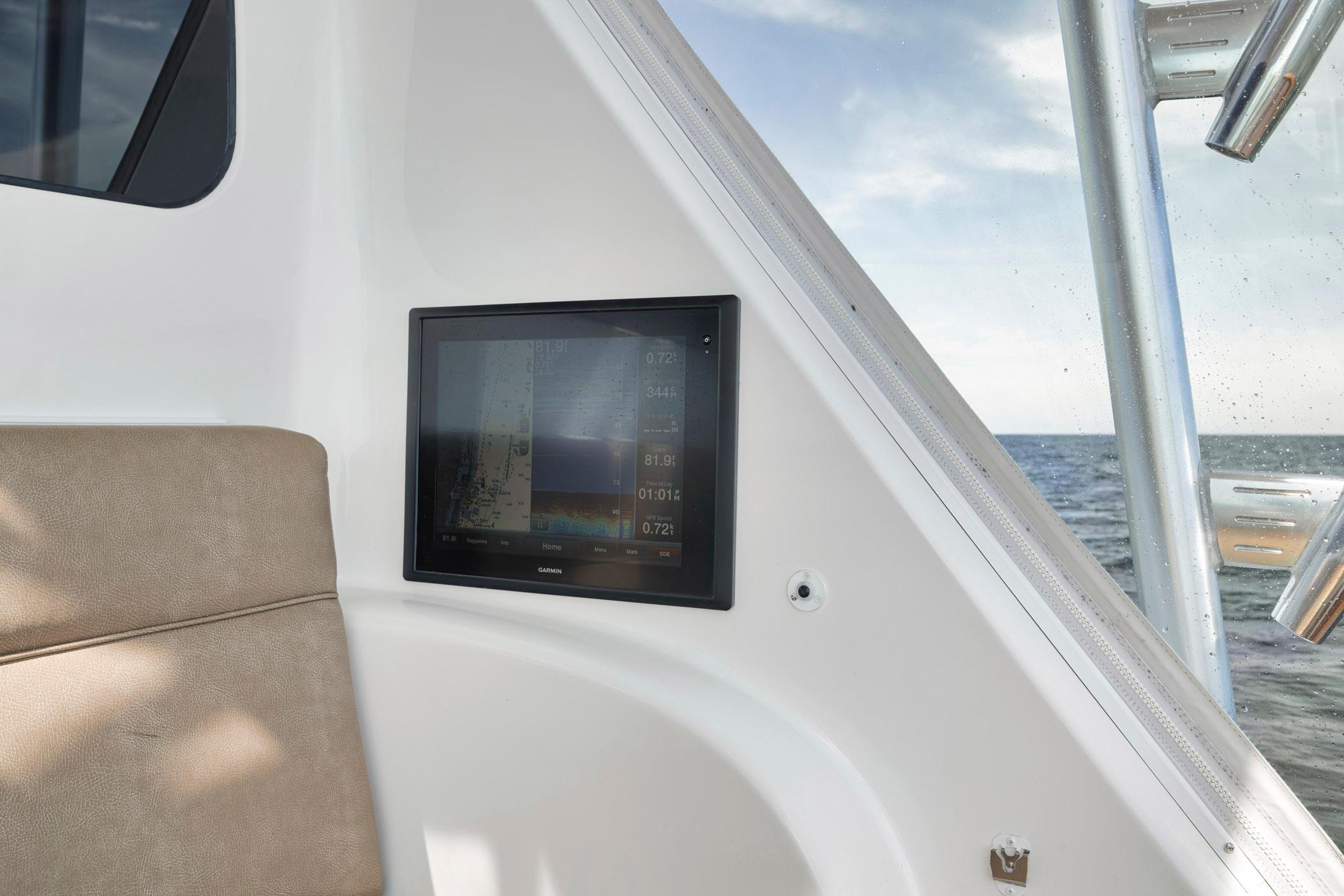 Viking 70 Convertible 2015 boat interior with navigation screen and ocean view.