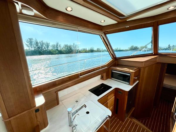Luxurious interior of 2025 Sabre 43 Salon Express yacht with scenic water view.