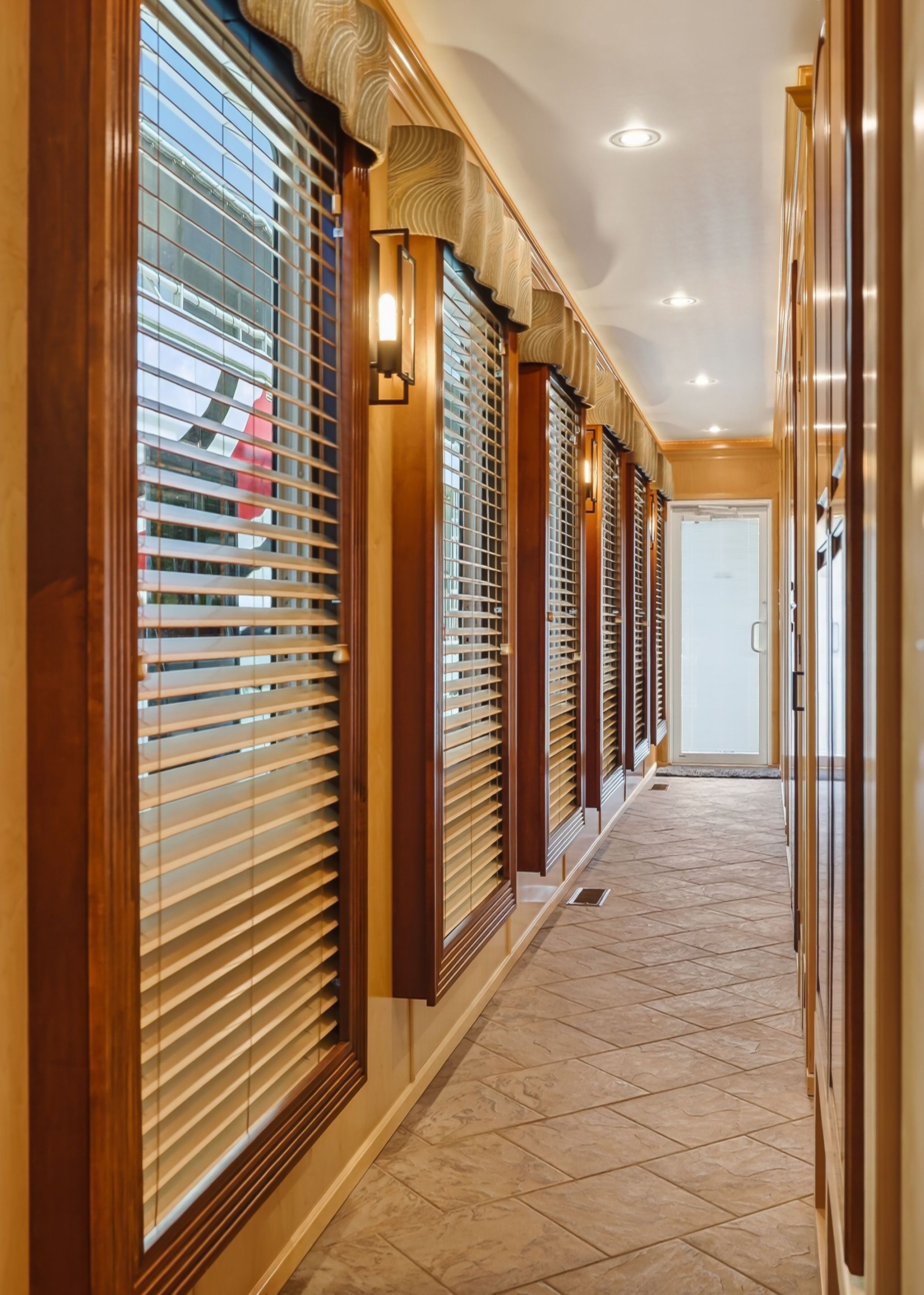 Interior view of 2010 Houseboat Throughbred with wooden blinds.