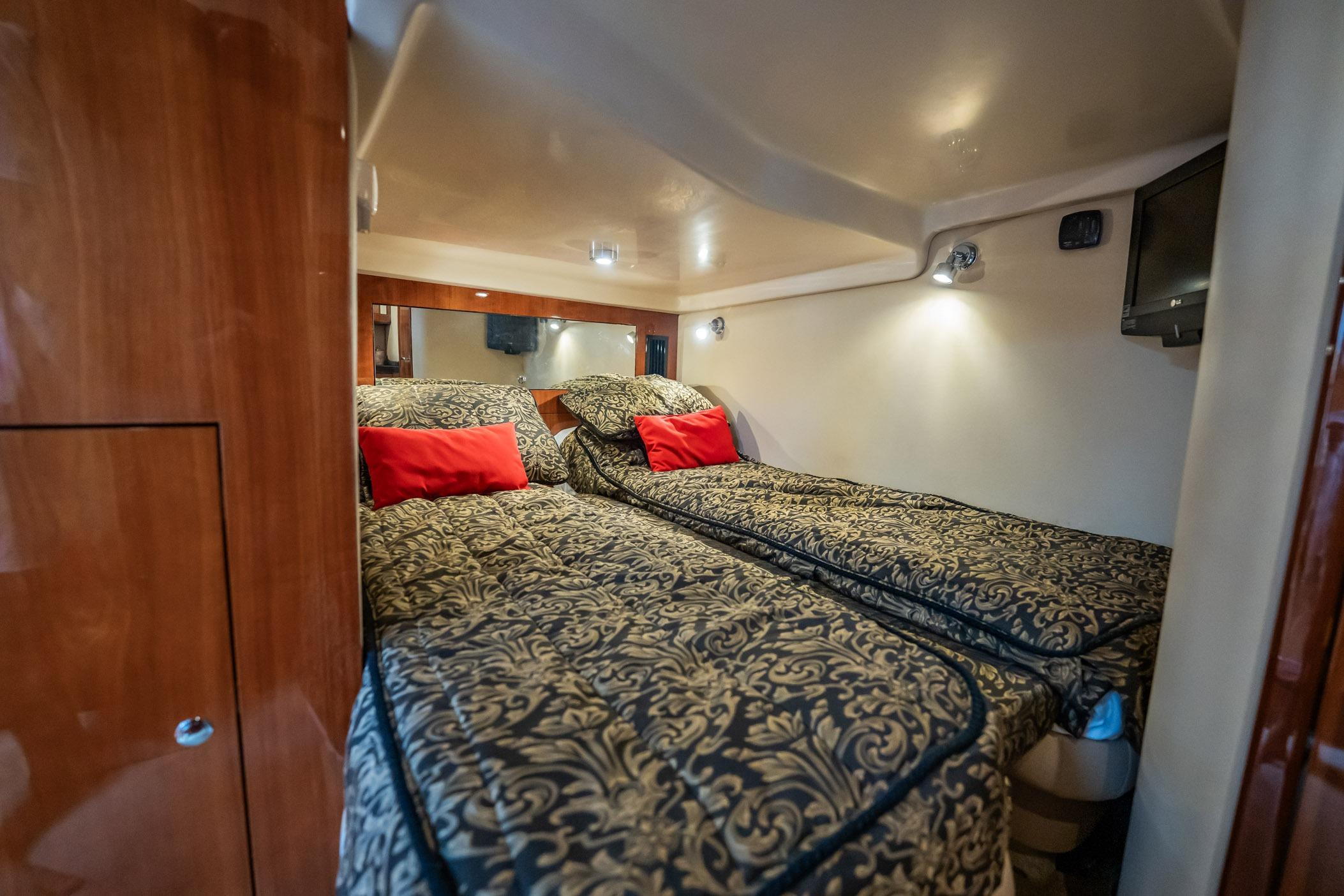 Luxurious 2008 Regal Commodore 4460 cabin with twin beds and elegant decor.