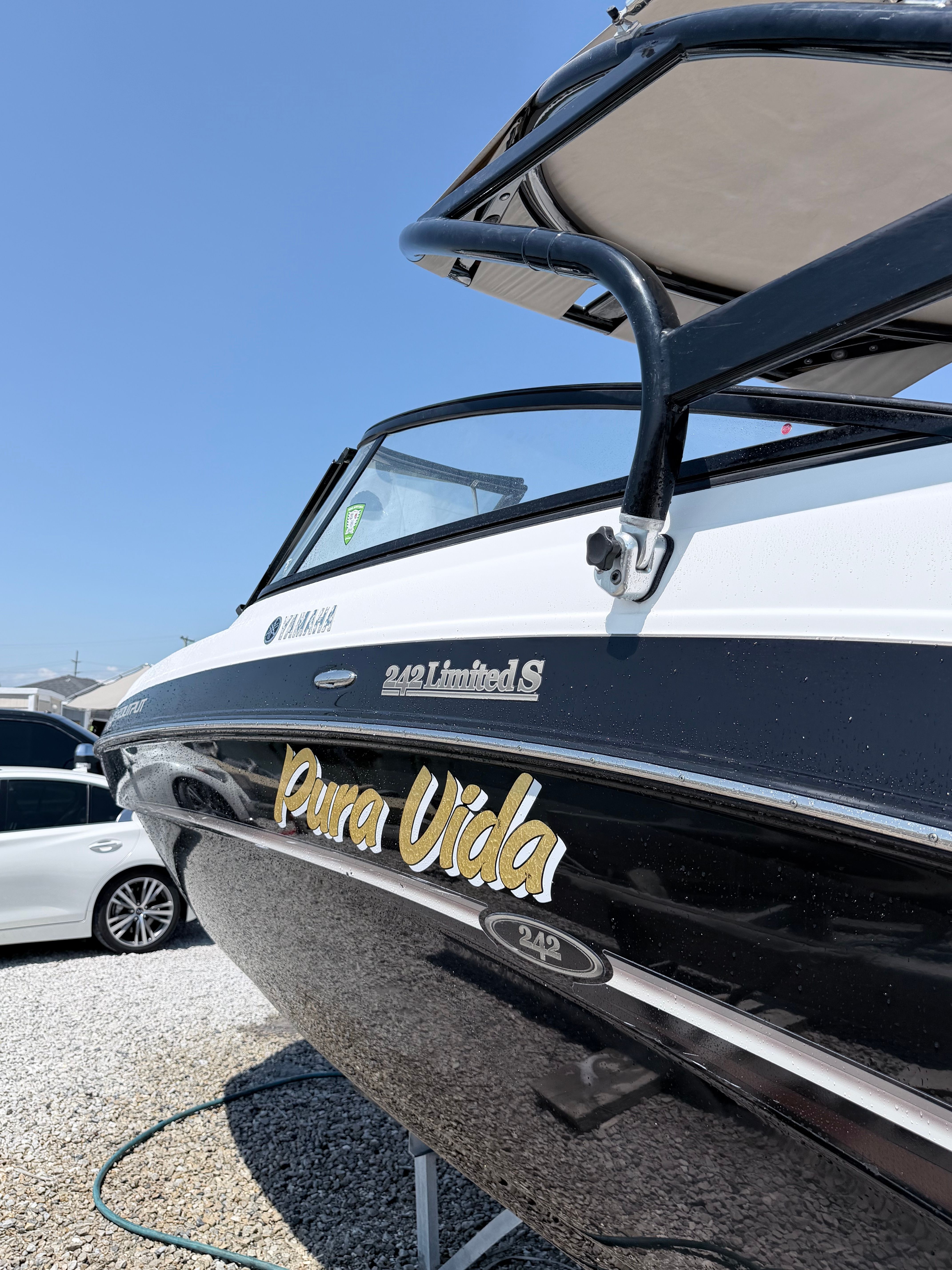 A 2014 Yamaha 242 Limited S boat with "Pura Vida" written on the side.