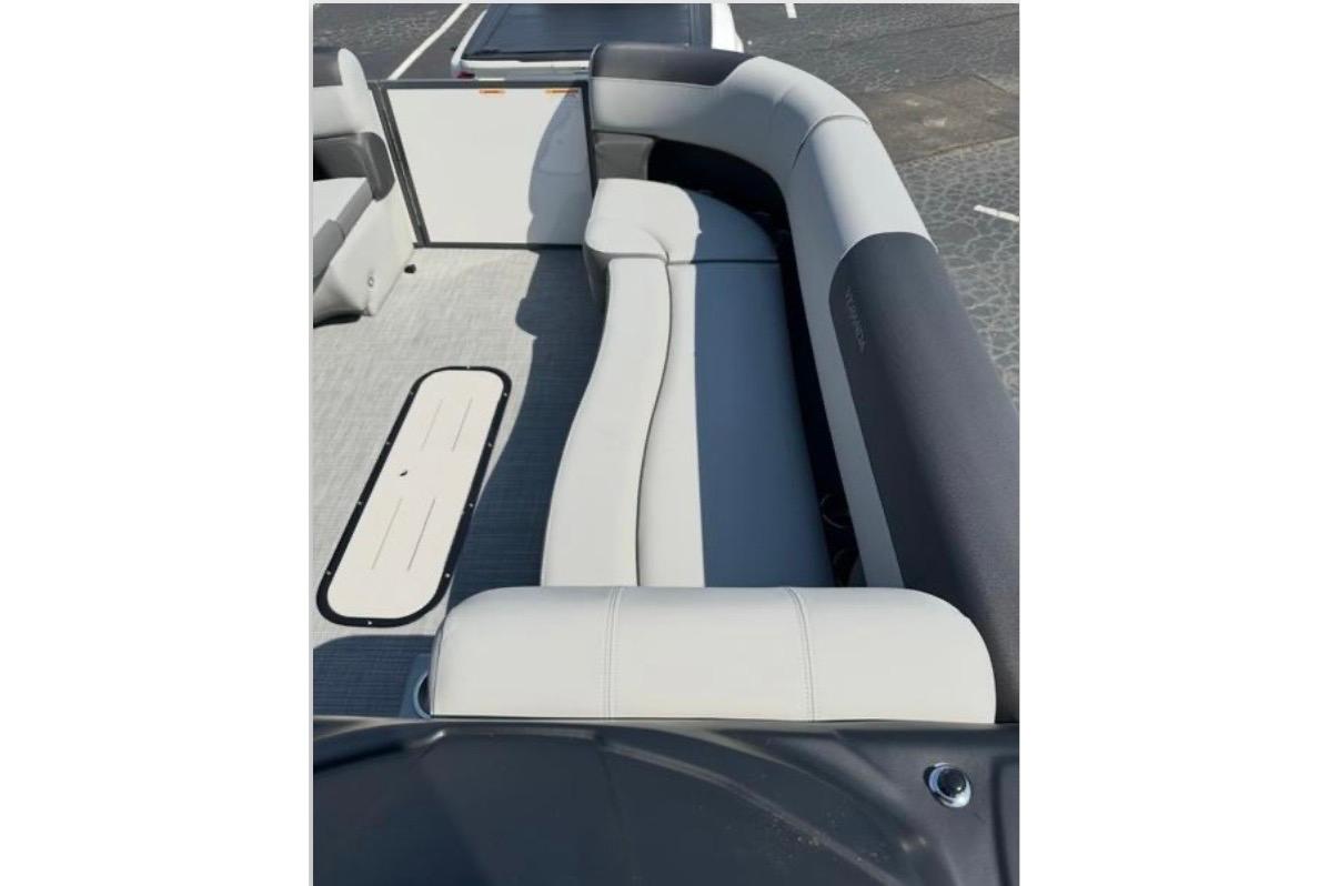Interior seating of 2025 Veranda Relax VR25VLC pontoon boat, featuring sleek, modern design.