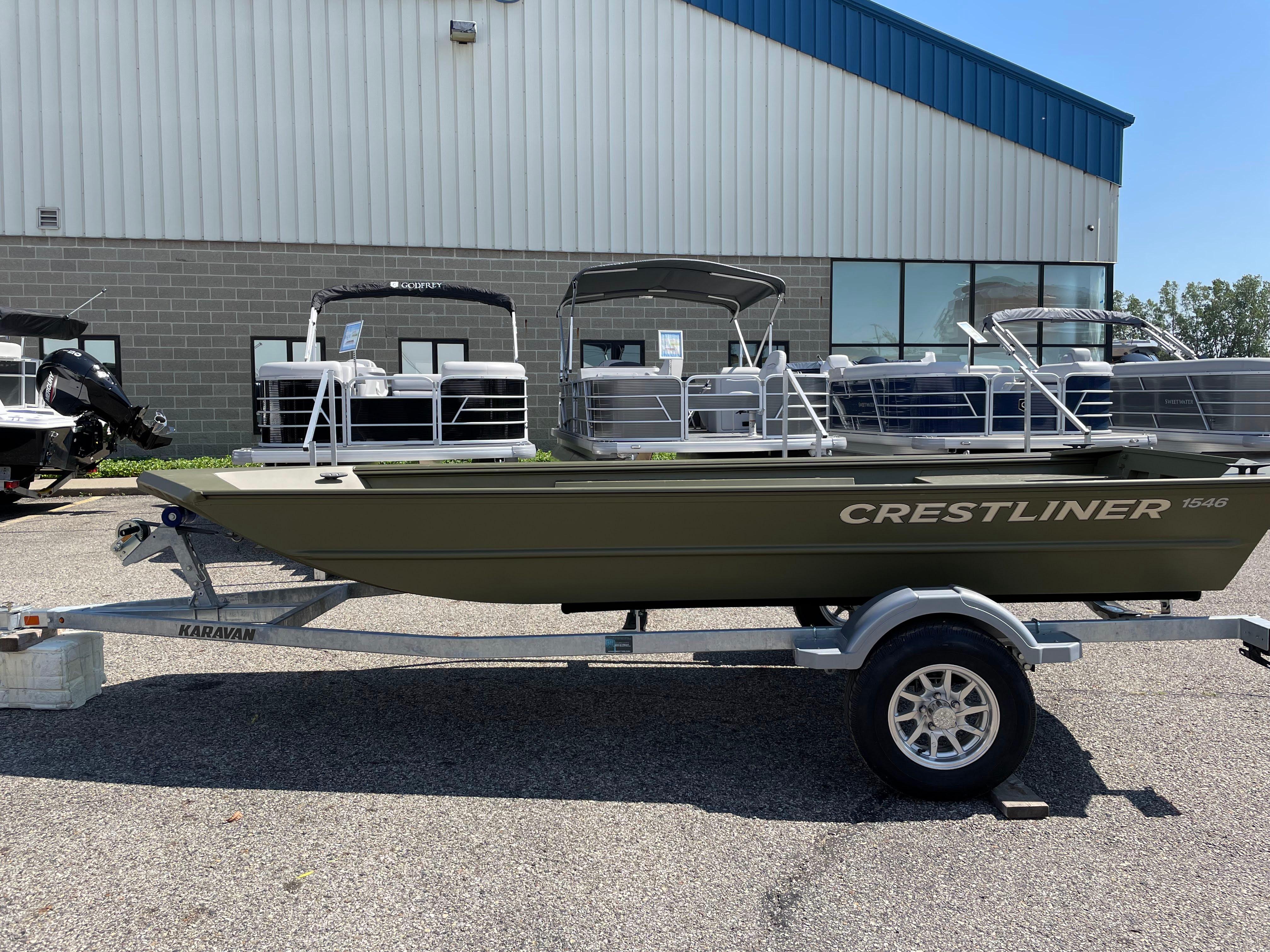 2024 Crestliner 1546 Retriever boat on trailer outside dealership.