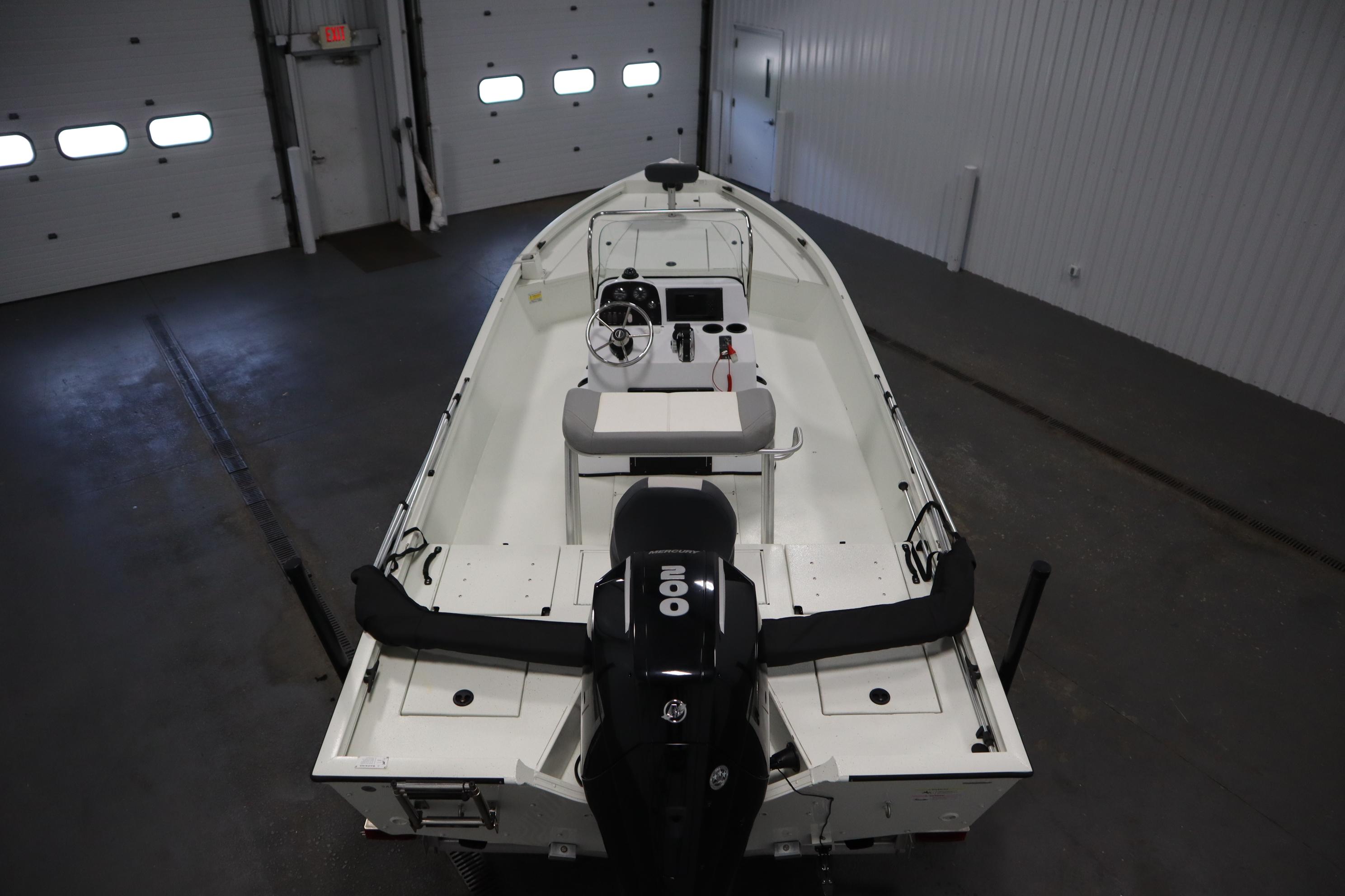2022 Crestliner 2200 CC boat in indoor storage, featuring a powerful outboard motor.