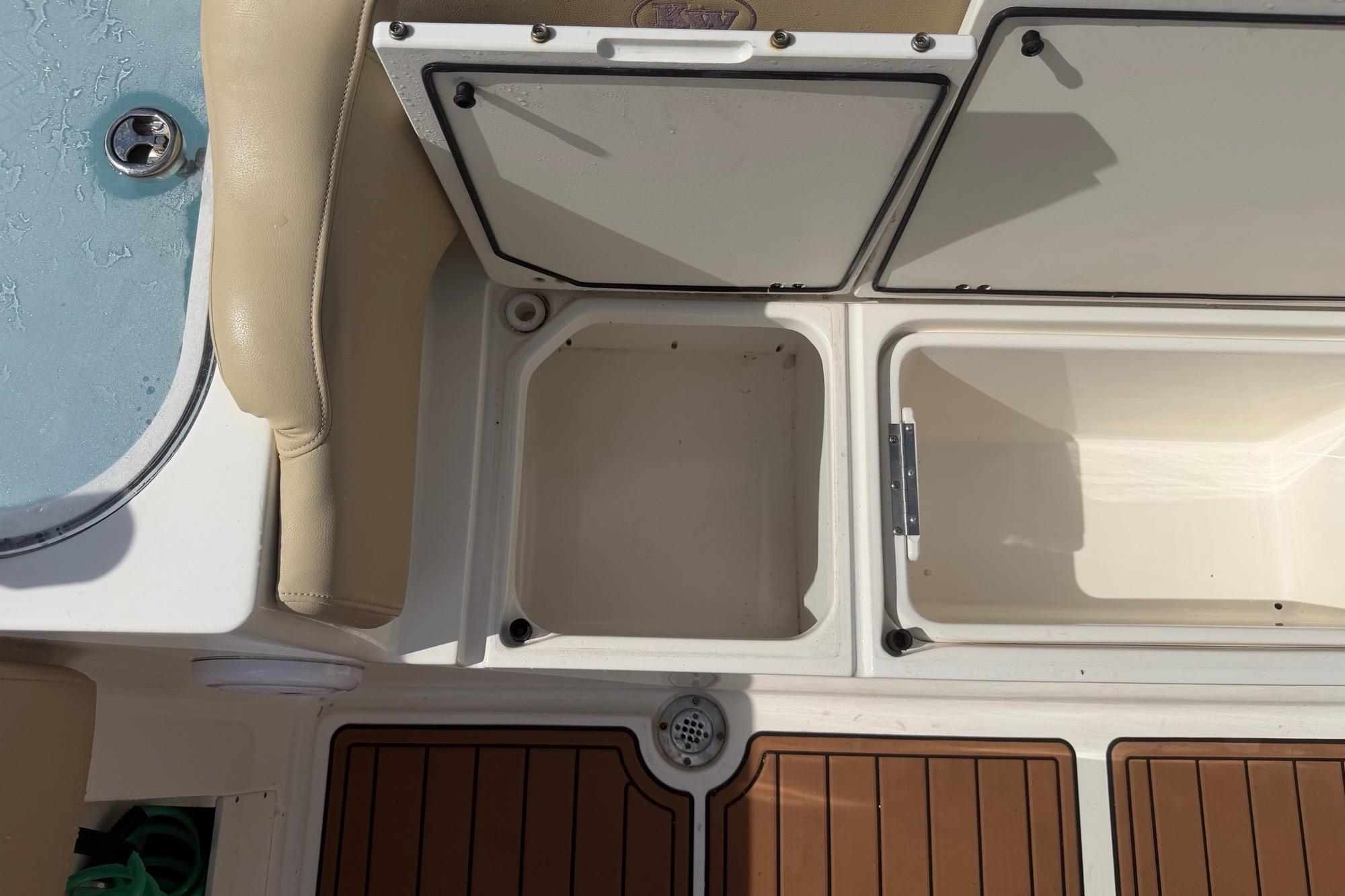 2019 Key West 263 FS boat storage compartments and seating area.