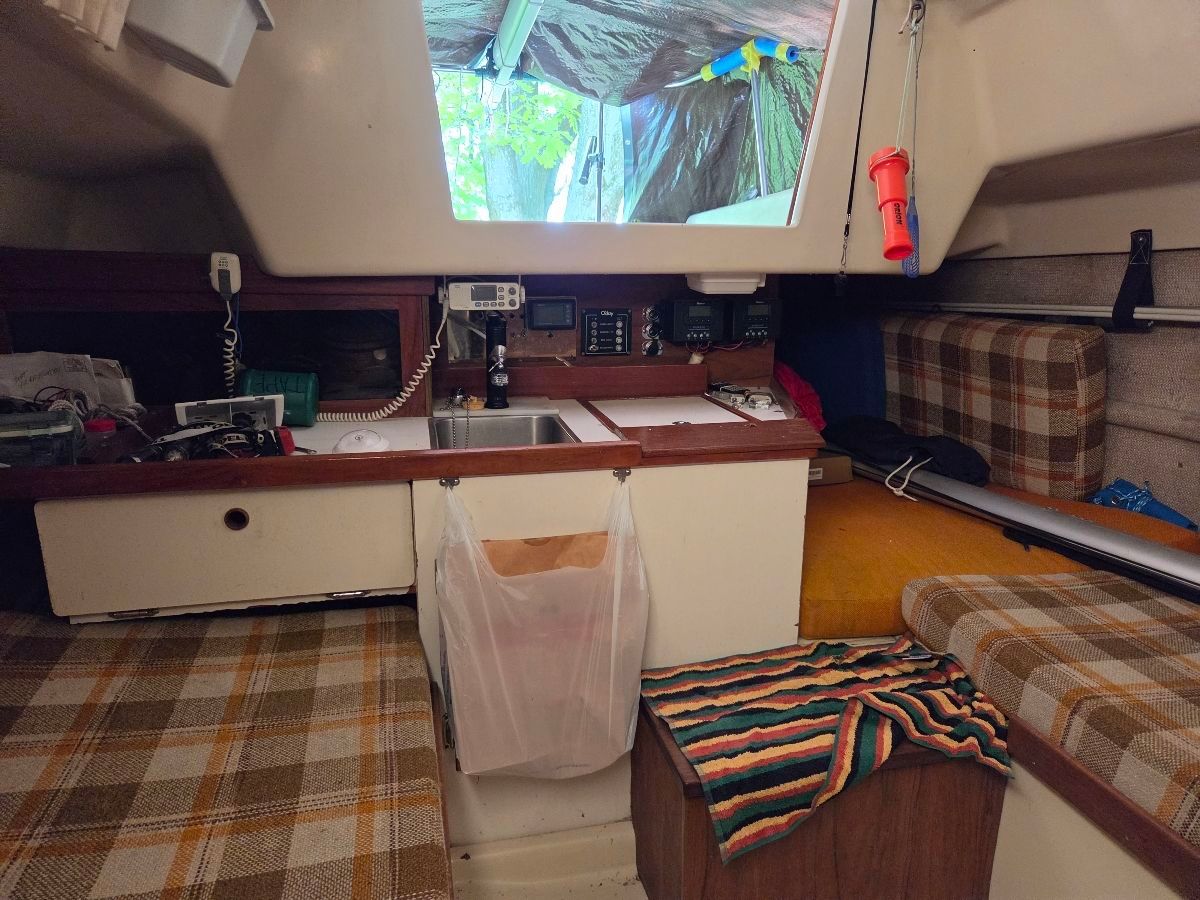 Interior of a 1979 O'Day Sloop with cozy furnishings.