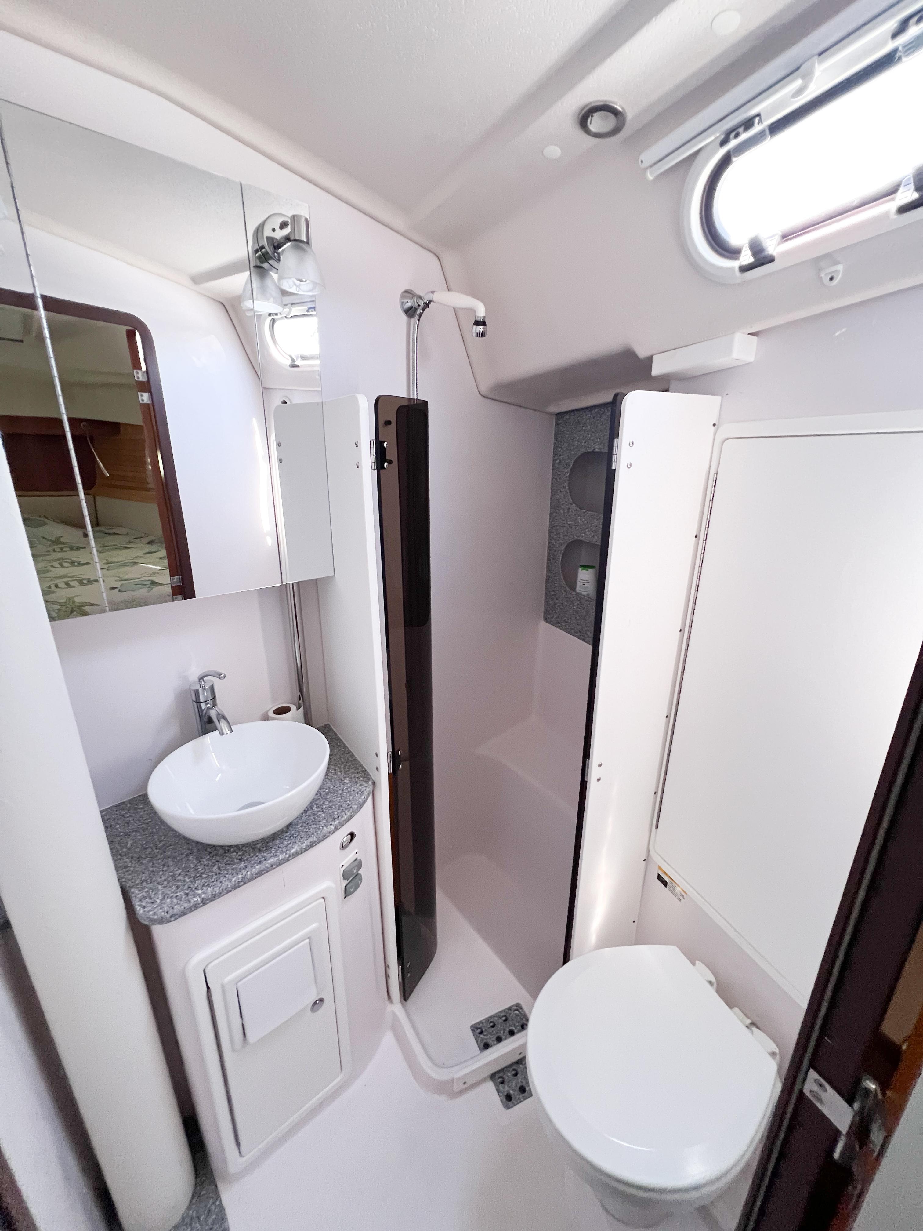 2019 Catalina 425 yacht bathroom with sink, toilet, and shower.