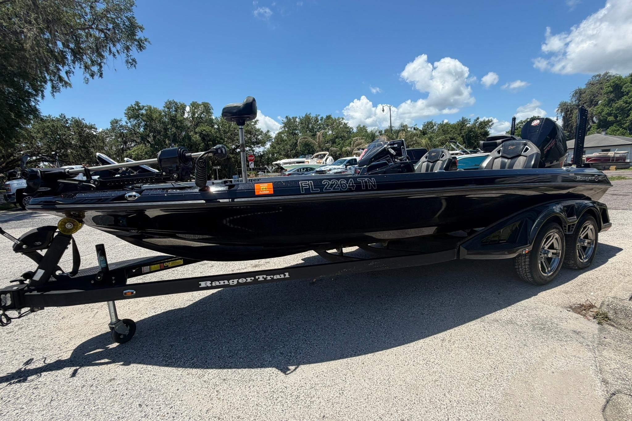 2023 Ranger Z521R boat on trailer under clear blue sky.
