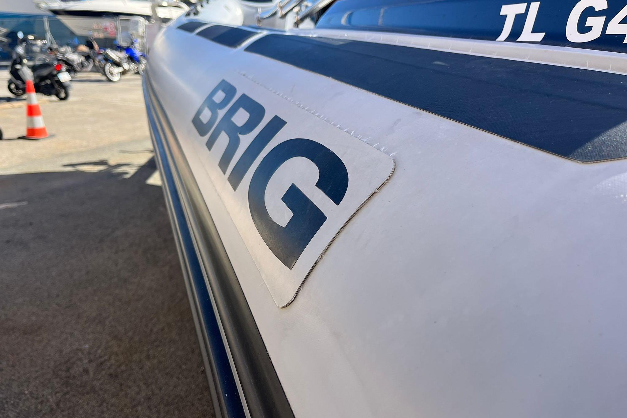 2022 Brig Eagle 6.7 boat close-up with logo, parked outdoors.
