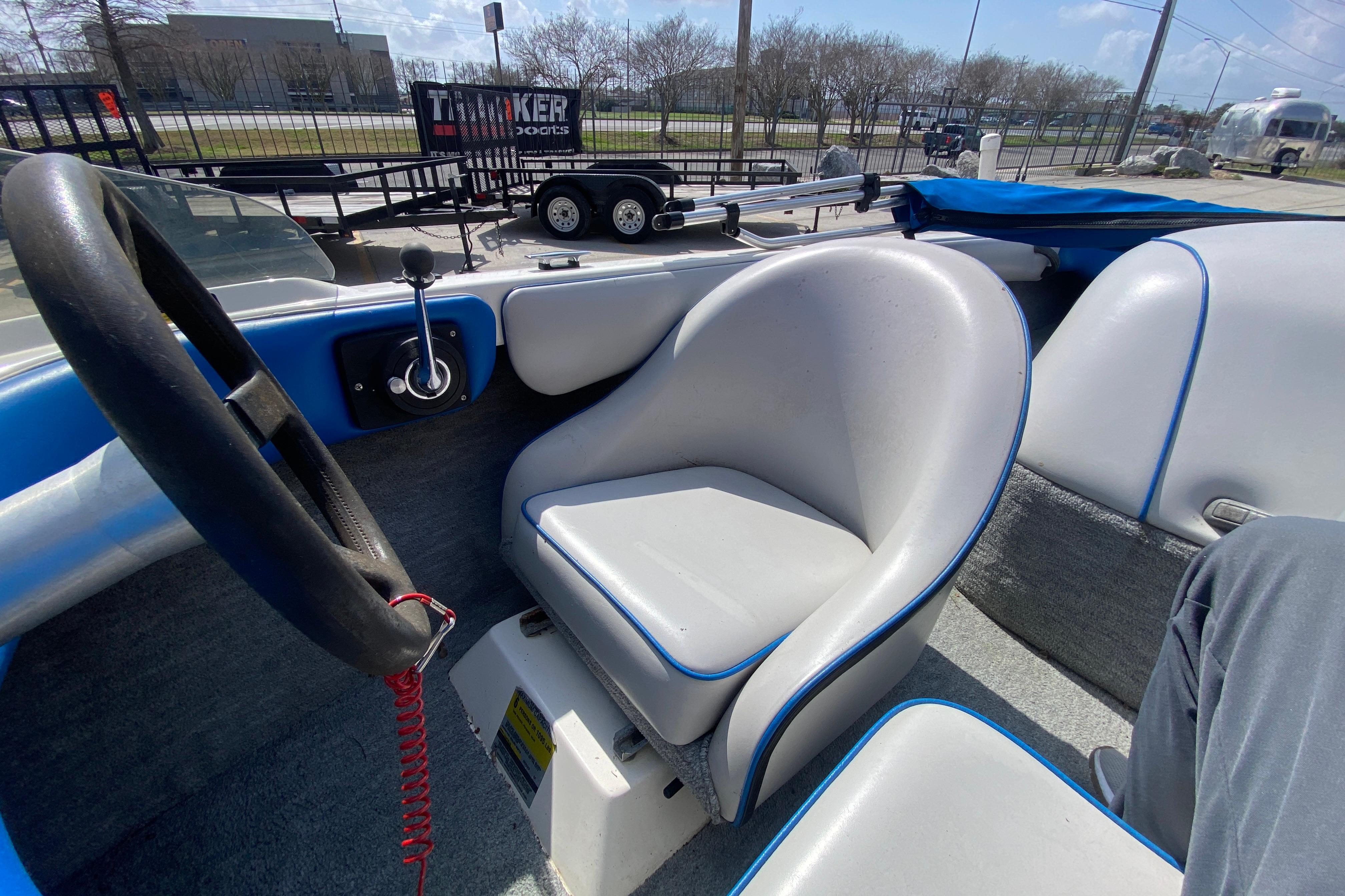 1997 Malibu Tantrum boat interior with steering wheel and seating.