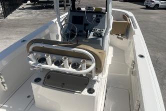 2023 Trophy T24 CC boat interior with steering console and rod holders.