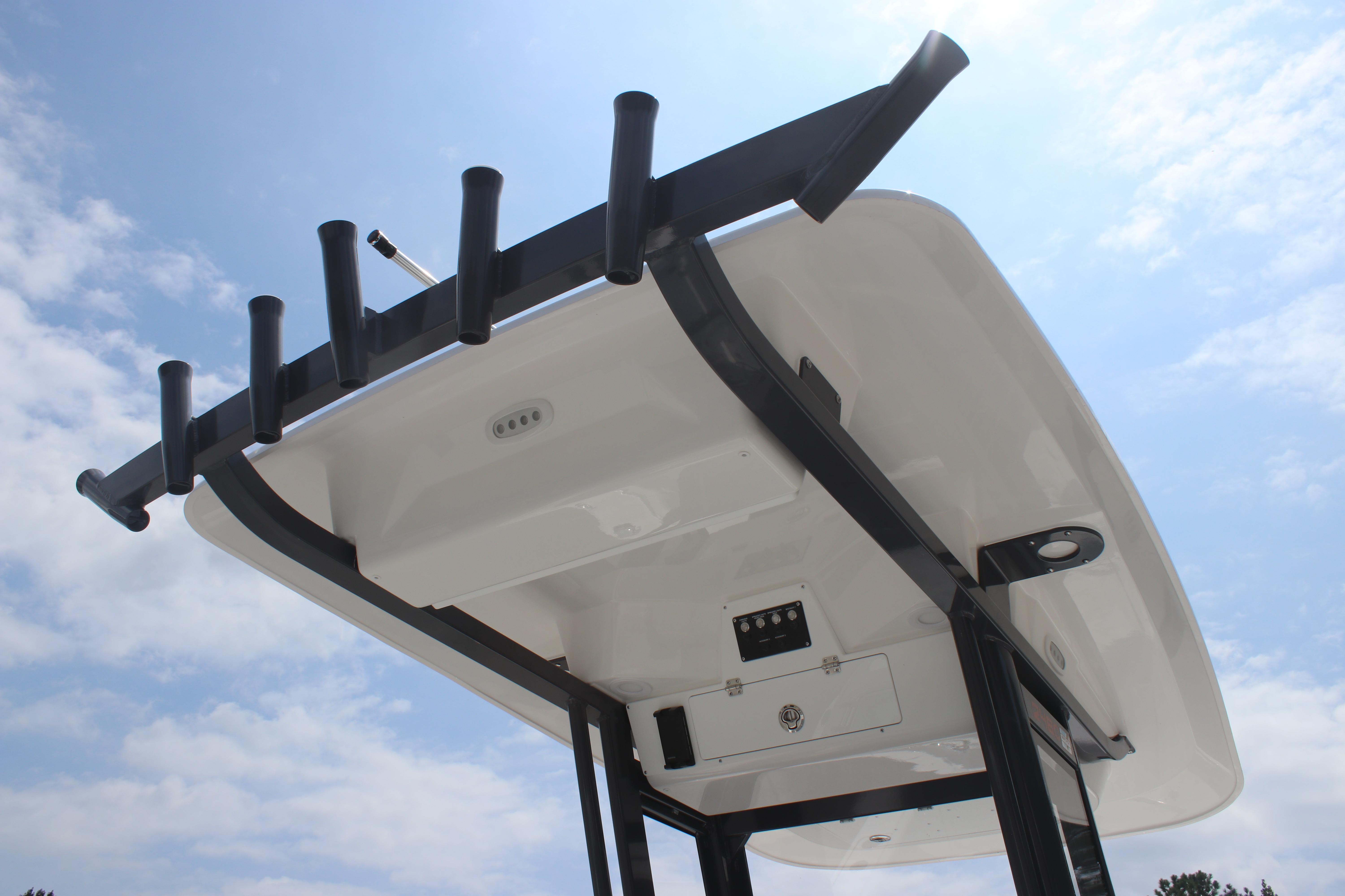 2026 Sea Fox 248 Commander boat top view with rod holders against a blue sky.