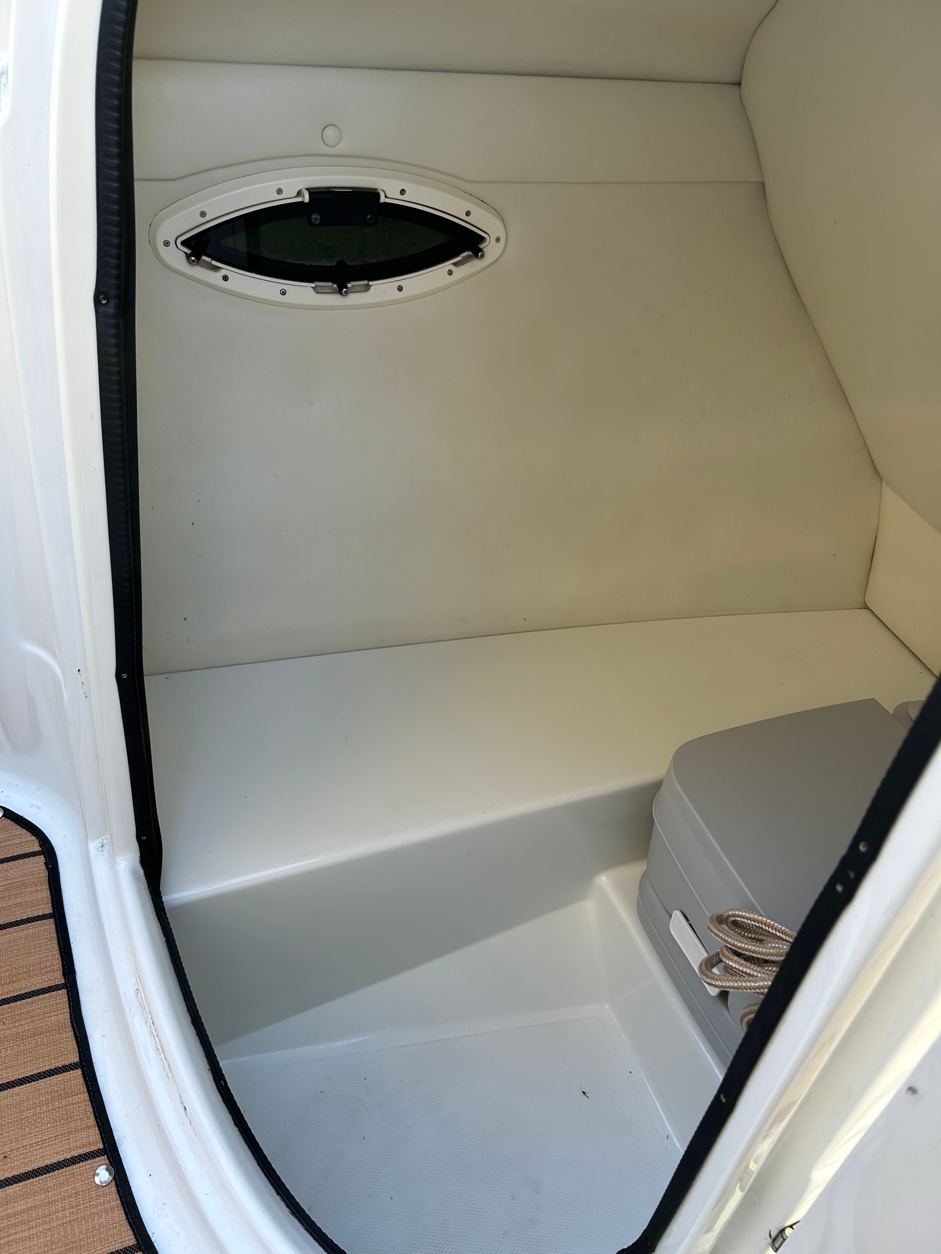 Interior of a 2008 Azure AZ220 with a bench seat and small window.