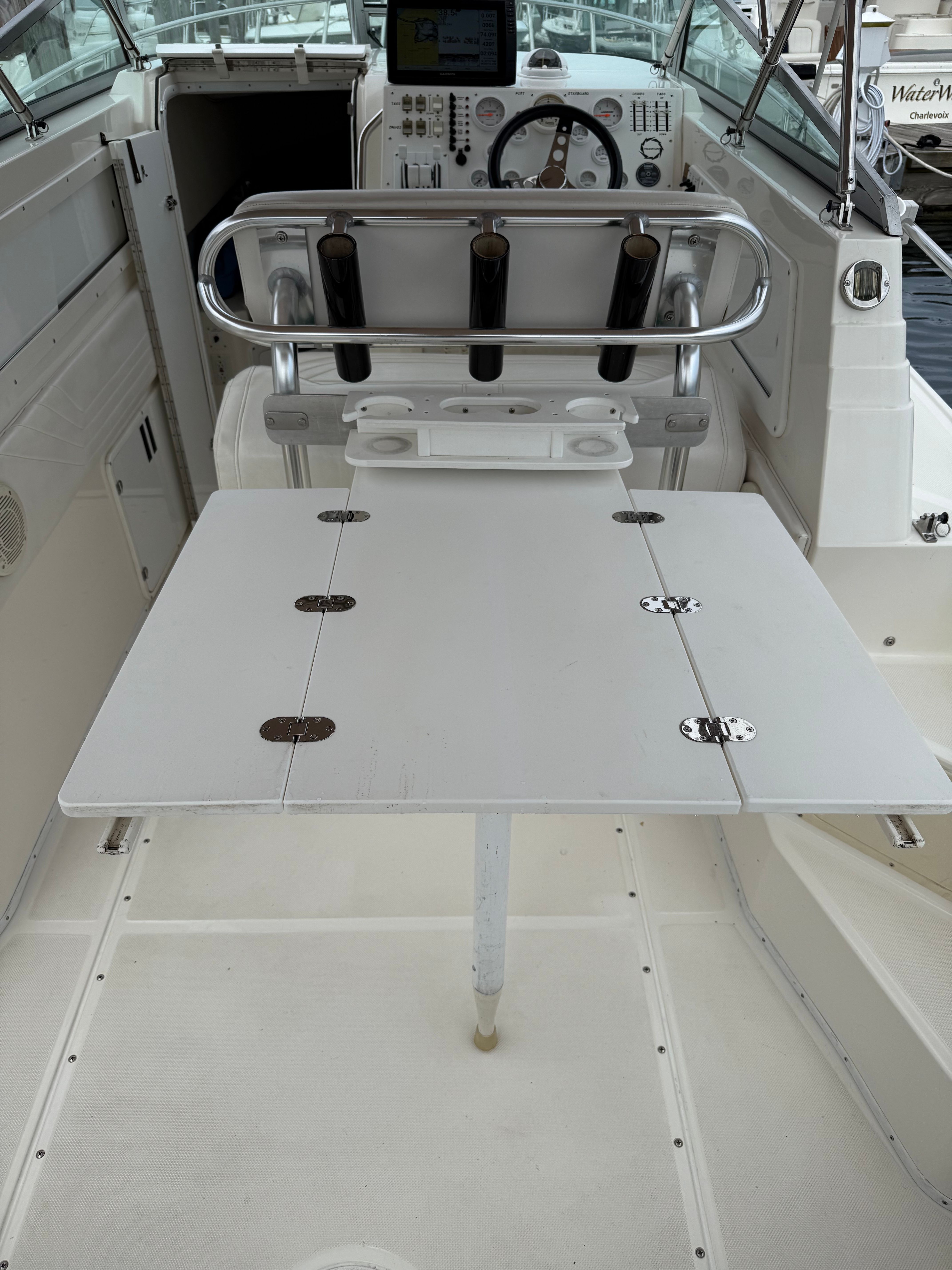 Interior view of a 1999 Fountain 32 Sport Fish Cruiser with helm station.
