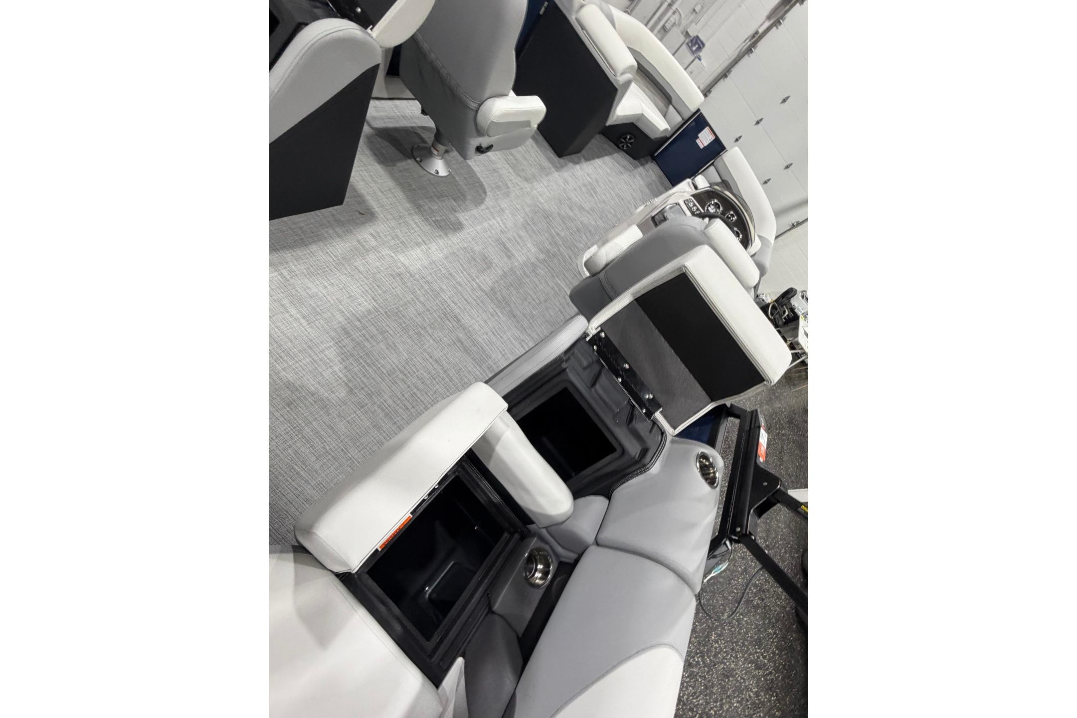 Interior of 2026 Lowe SS 230 WT boat with open storage compartments and seating.