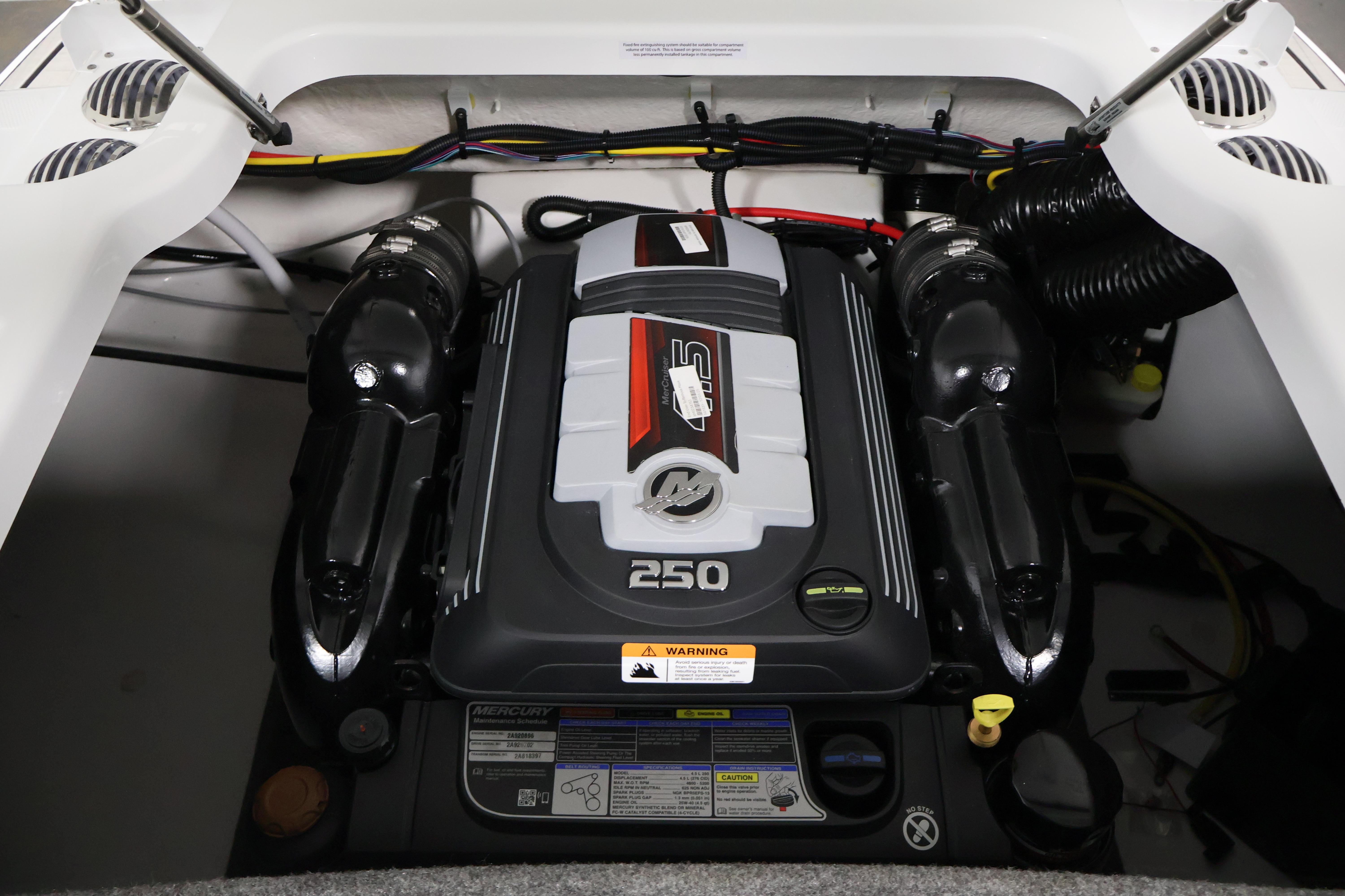 Engine compartment of 2026 Four Winns H4 Freedom boat, featuring a powerful 250 HP engine.