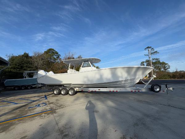 2025 Yellowfin 39 Offshore boat on a trailer, parked outdoors under a clear sky.
