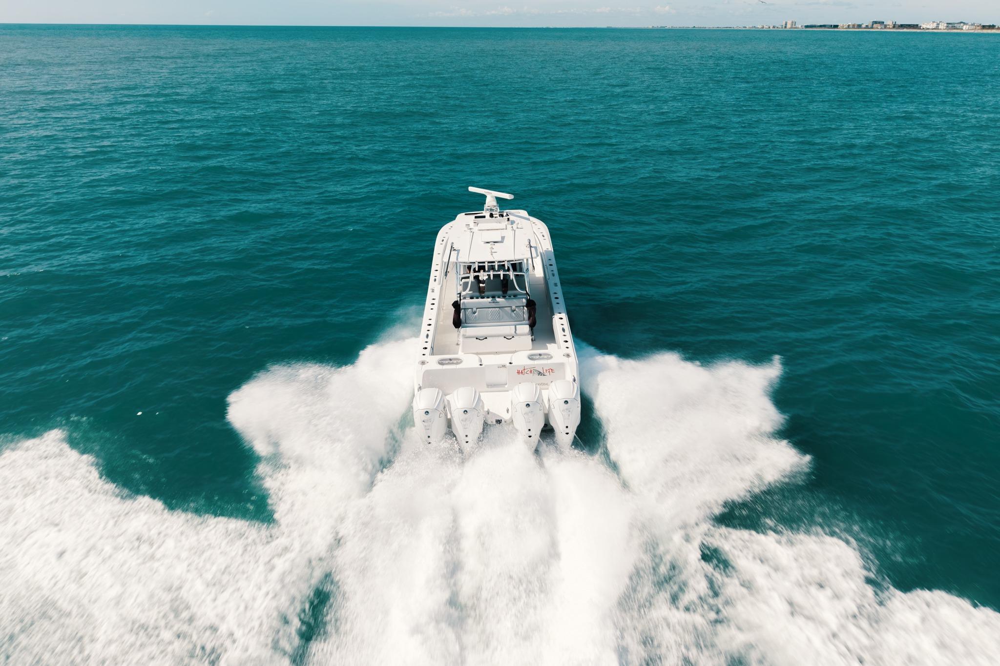 2021 SeaHunter 41 CTS boat cruising swiftly on open ocean waters.