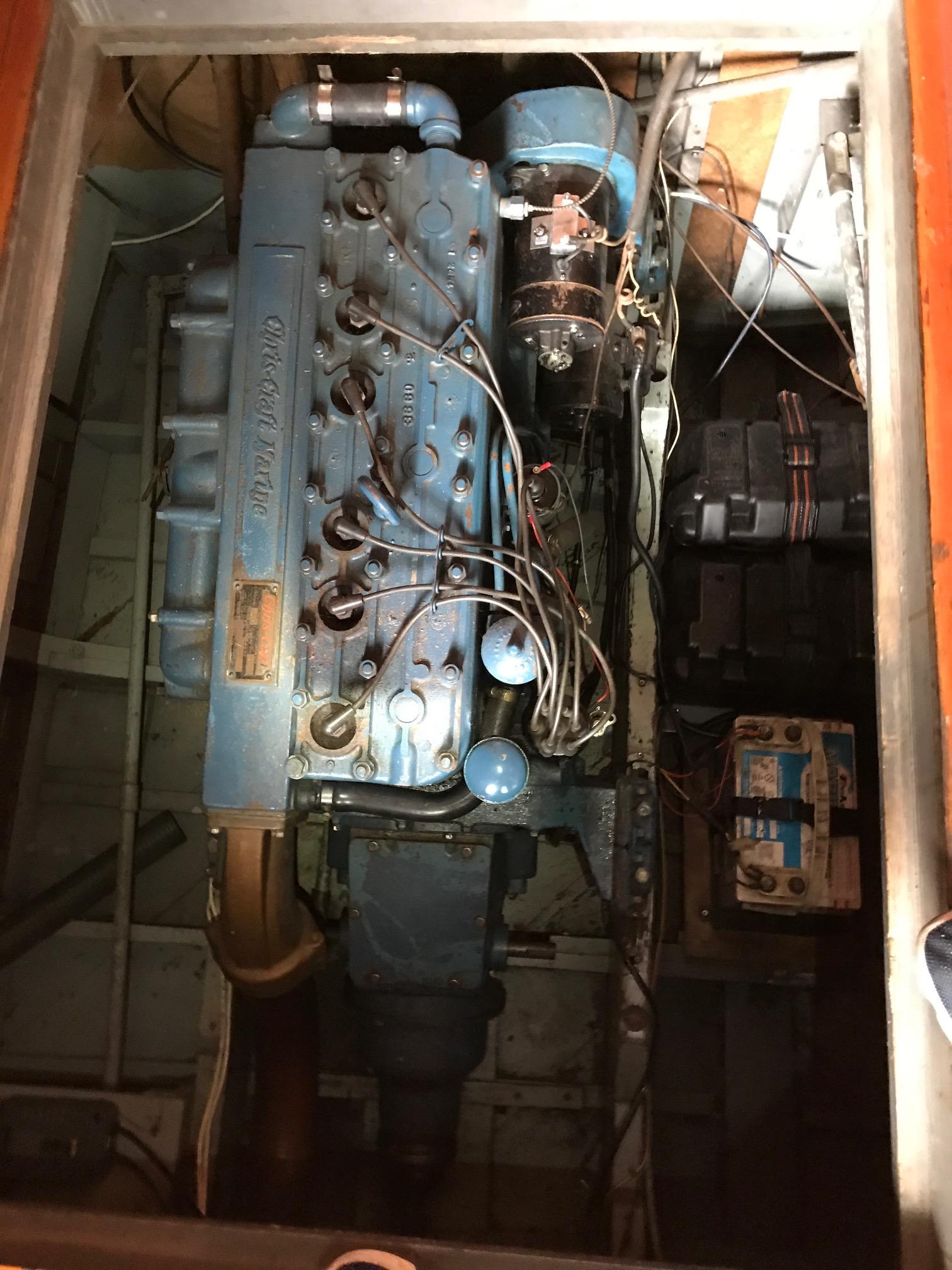 1954 Chris-Craft Commander engine compartment with visible wiring and components.