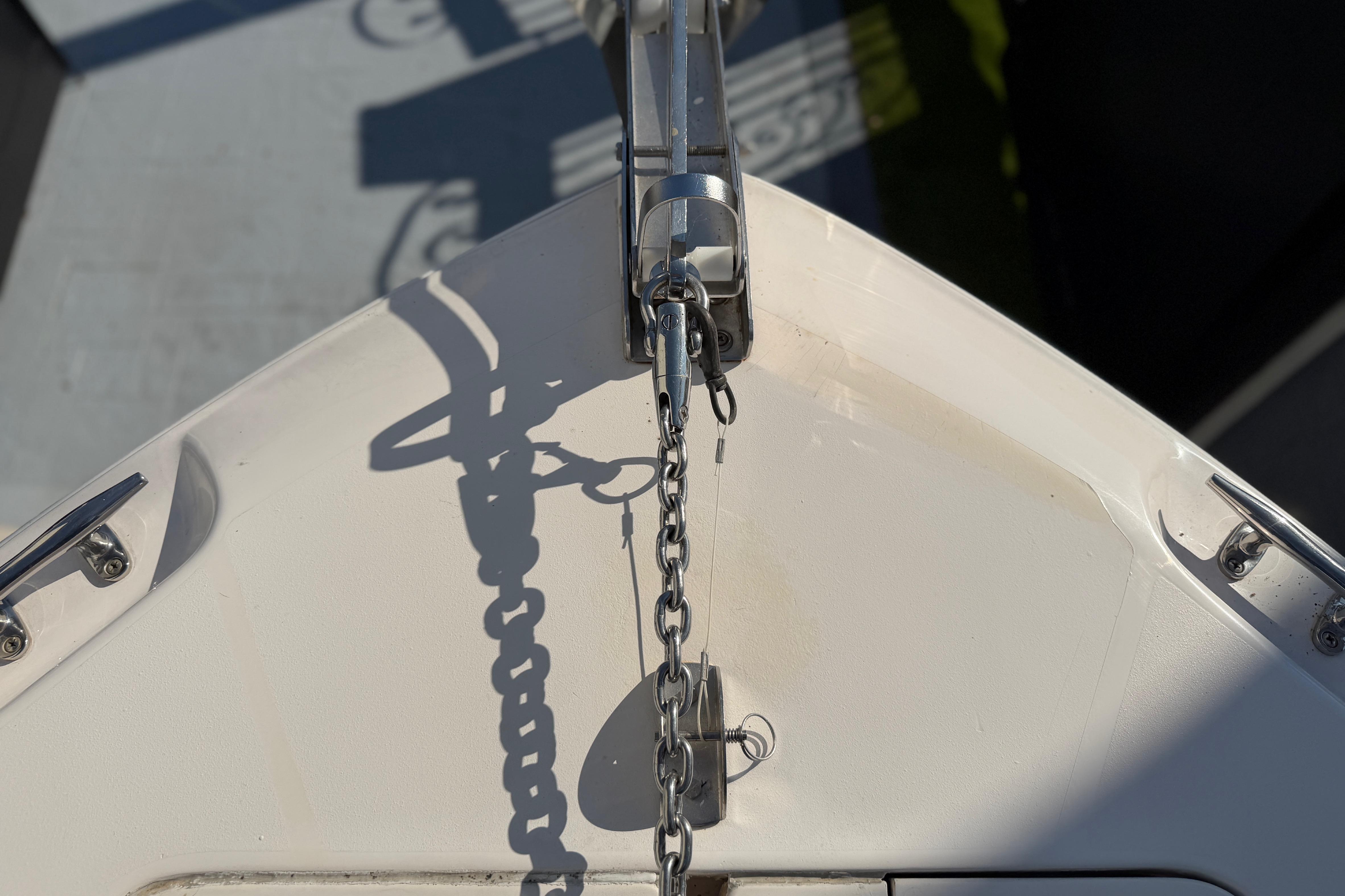 Bow of 2004 Grady White 273 boat with anchor chain and cleats.