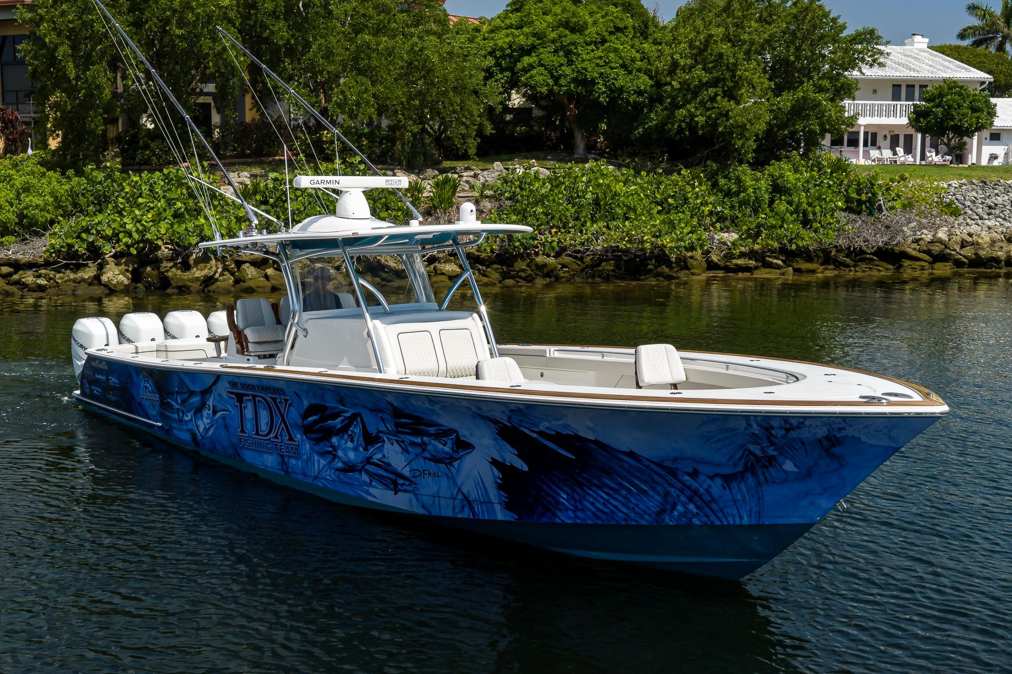2020 Valhalla Boatworks V-41 with custom graphics, cruising on a calm waterway.