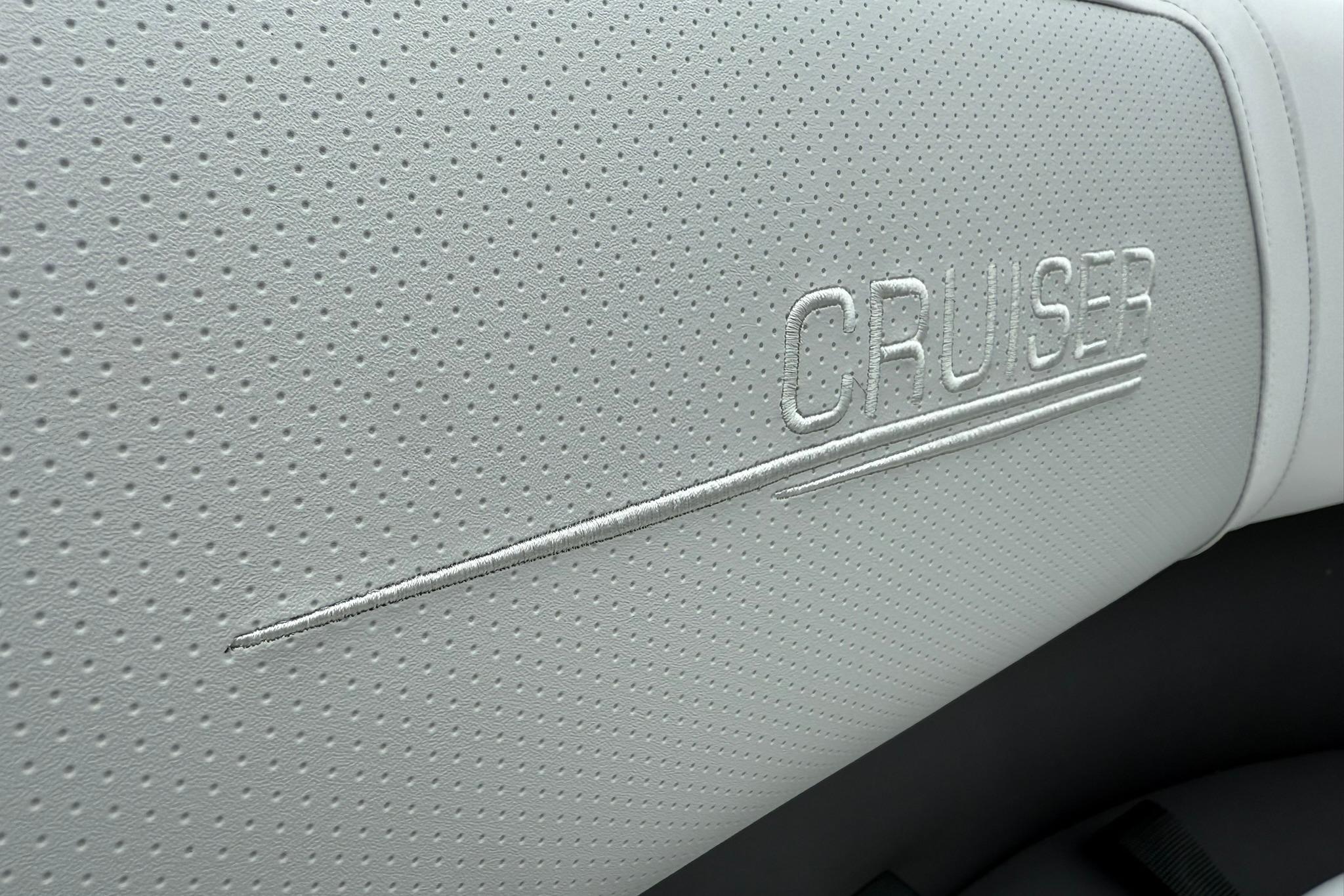 Perforated white leather seat with "Cruiser" embroidery, Harris Cruiser 230 CWDH 2026.