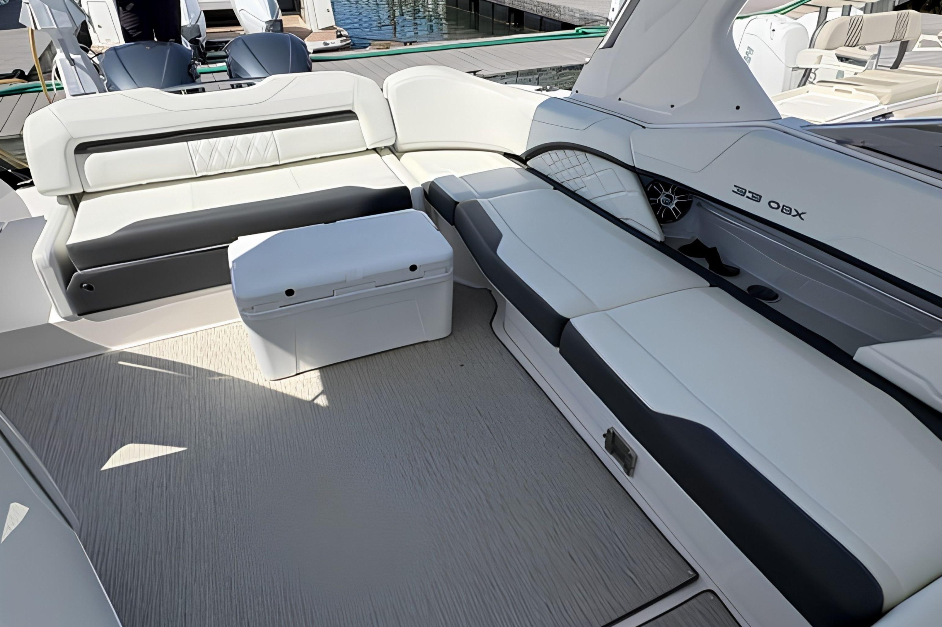 Luxurious seating area on a 2020 Regal 33 OBX boat, featuring sleek white upholstery.