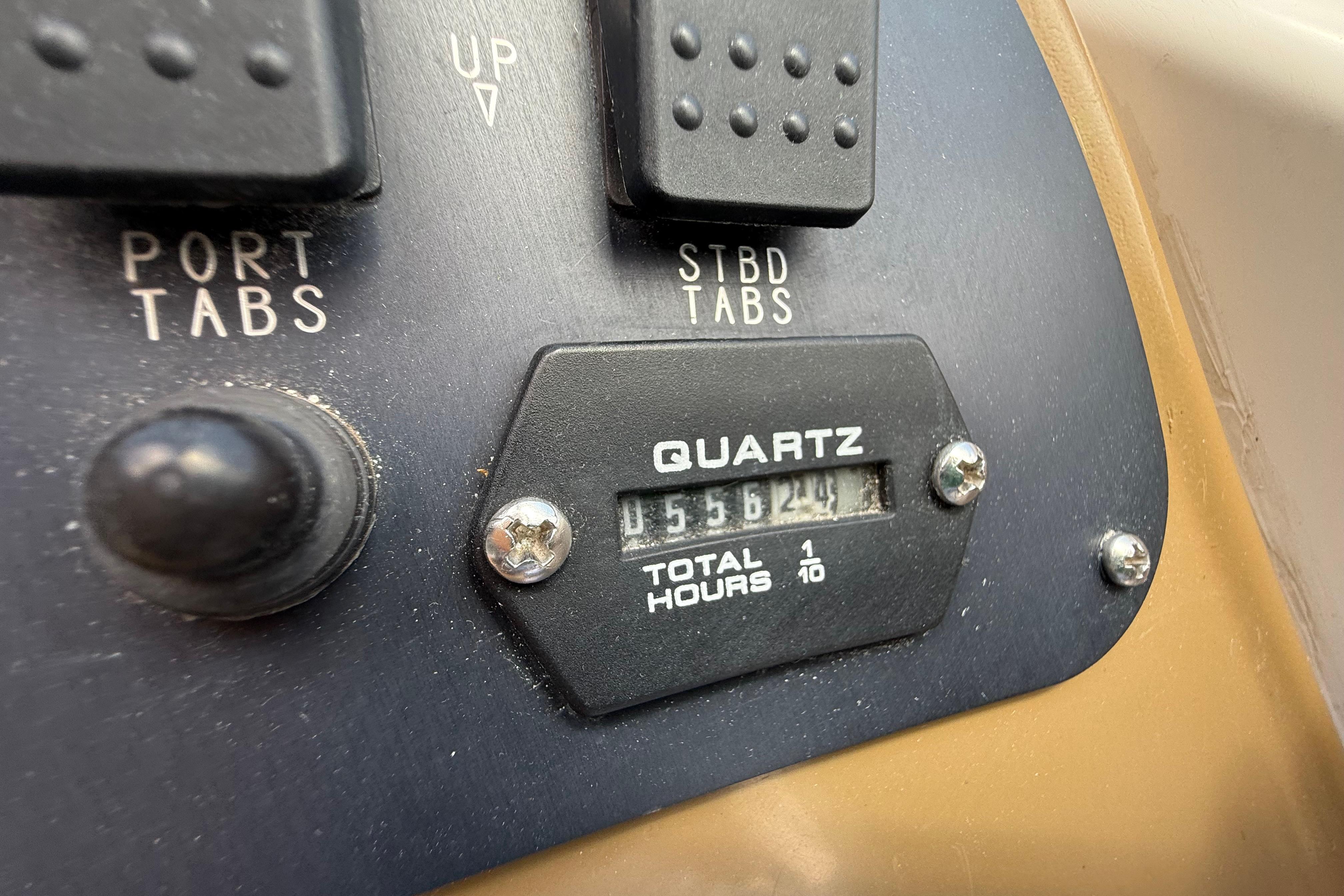 Control panel of a 1999 Chaparral Signature 300 boat showing port and starboard tabs.