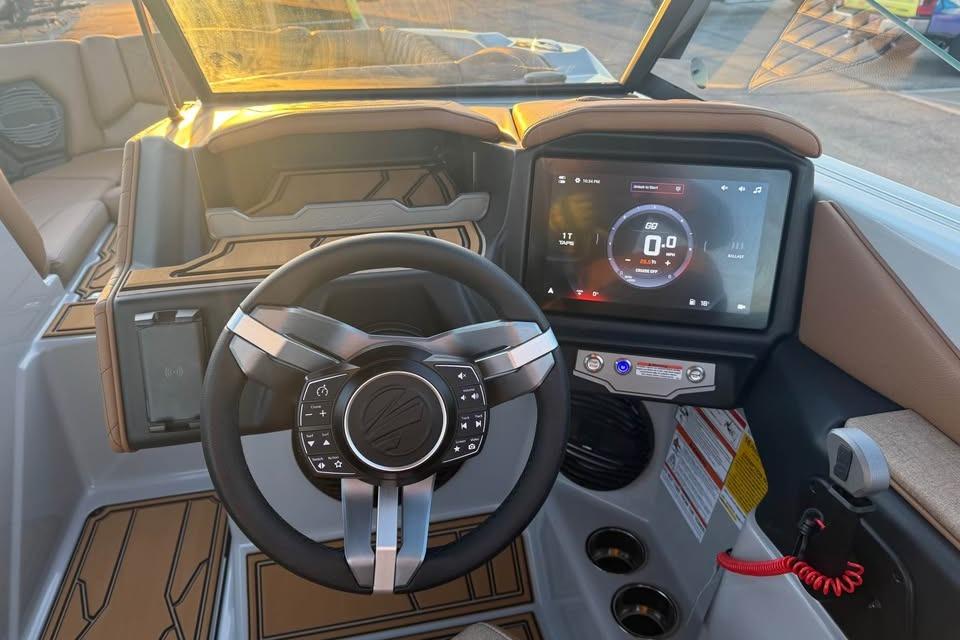 2026 Tigé Z3 boat dashboard with modern steering wheel and digital display.