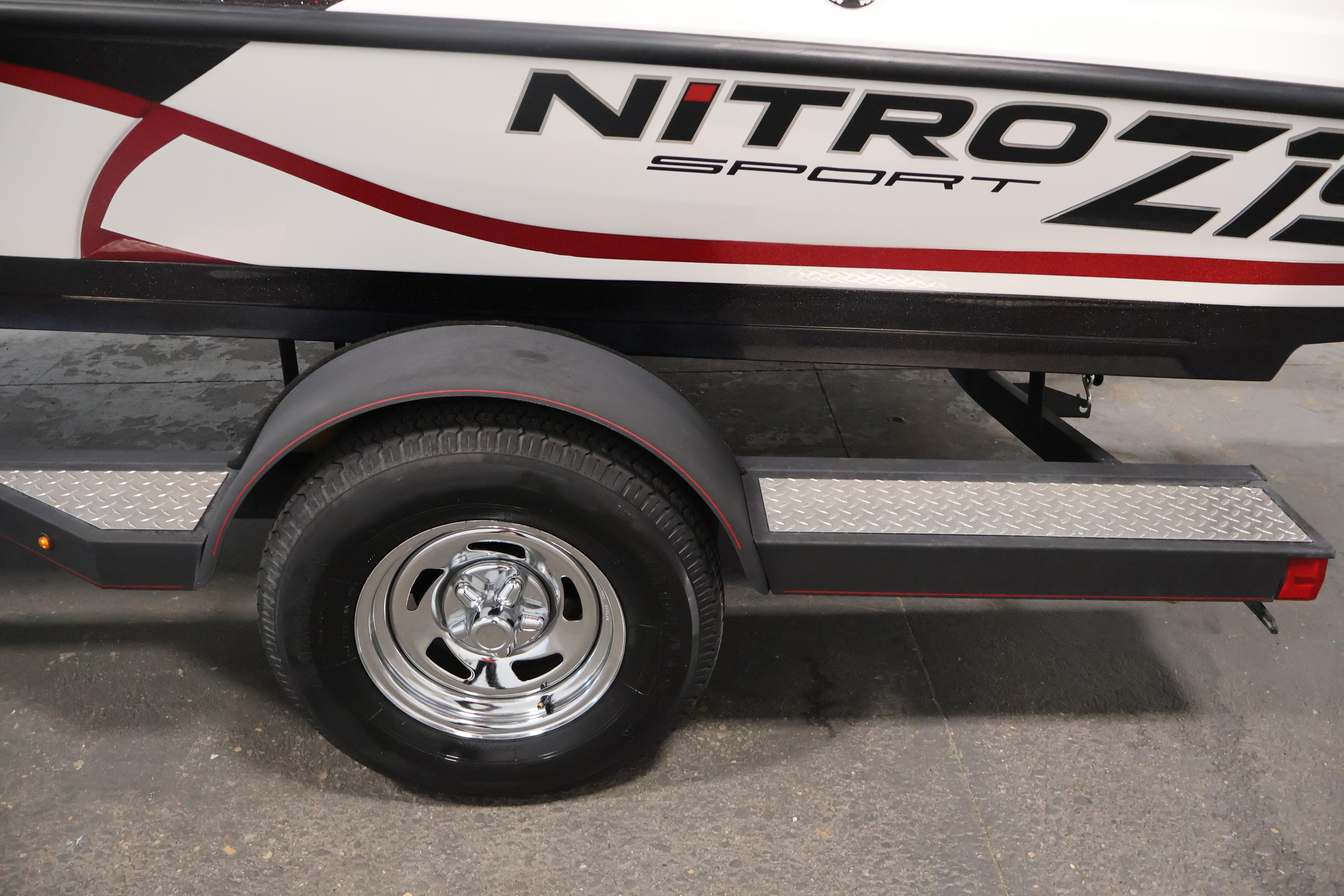 2019 Nitro Z19 Sport trailer with chrome wheel and diamond plate step.