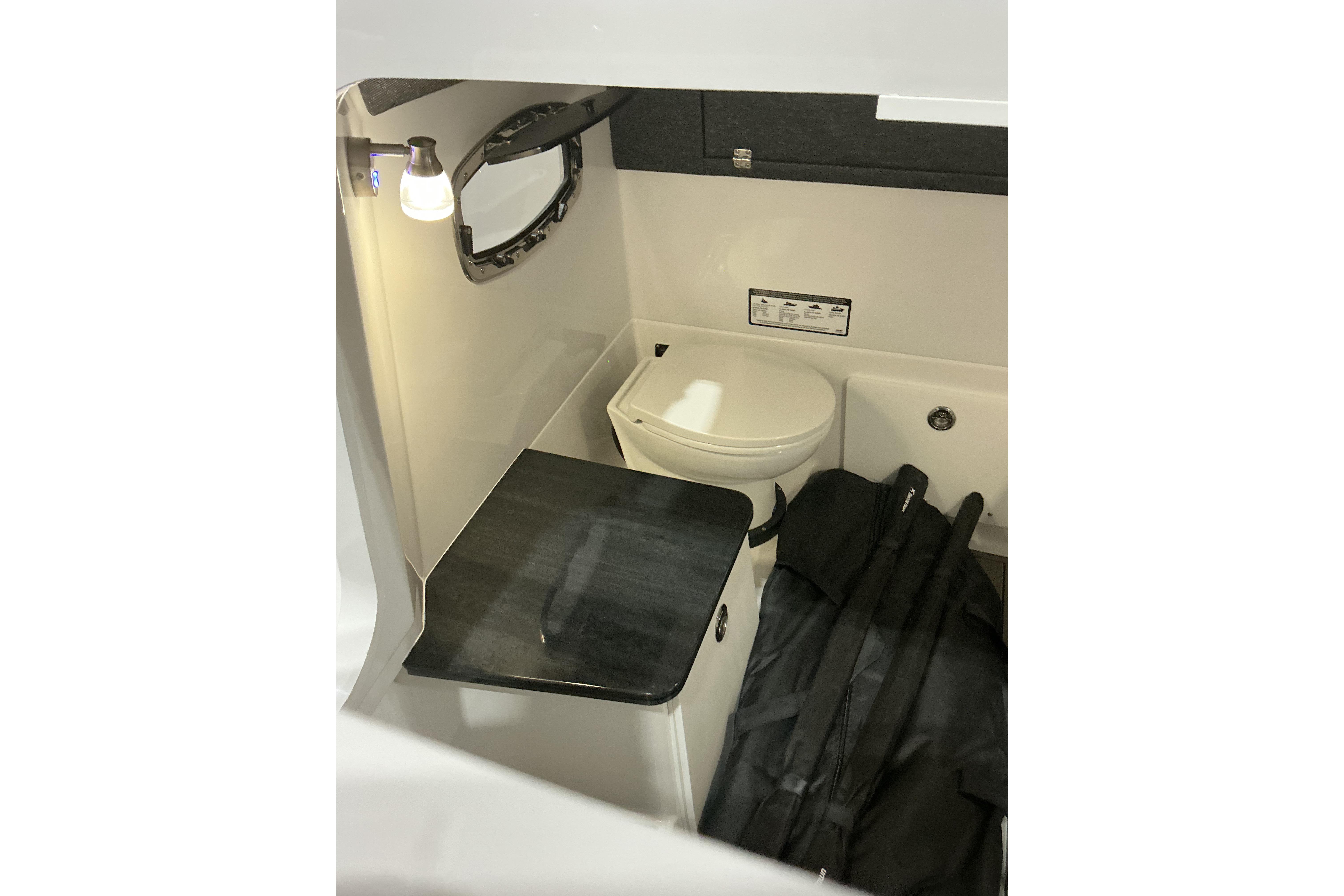 2026 Monterey Elite 25 SD boat interior with compact bathroom amenities.