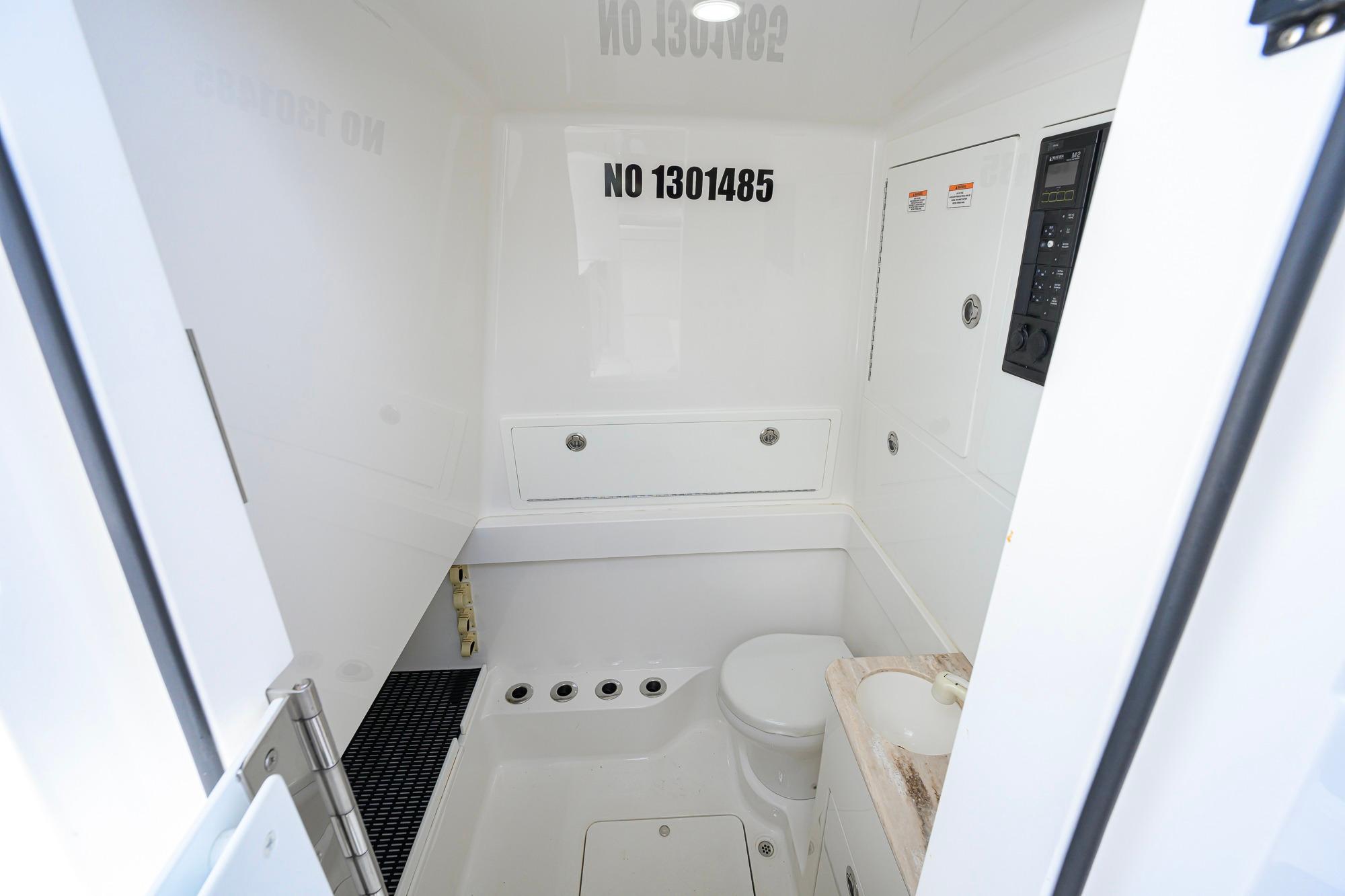 2020 Valhalla Boatworks V-41 interior bathroom with sink and toilet.