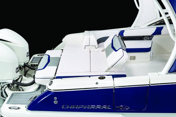 Manufacturer Provided Image: 2019 Chaparral 300 OSX boat with white and blue seating and twin engines.