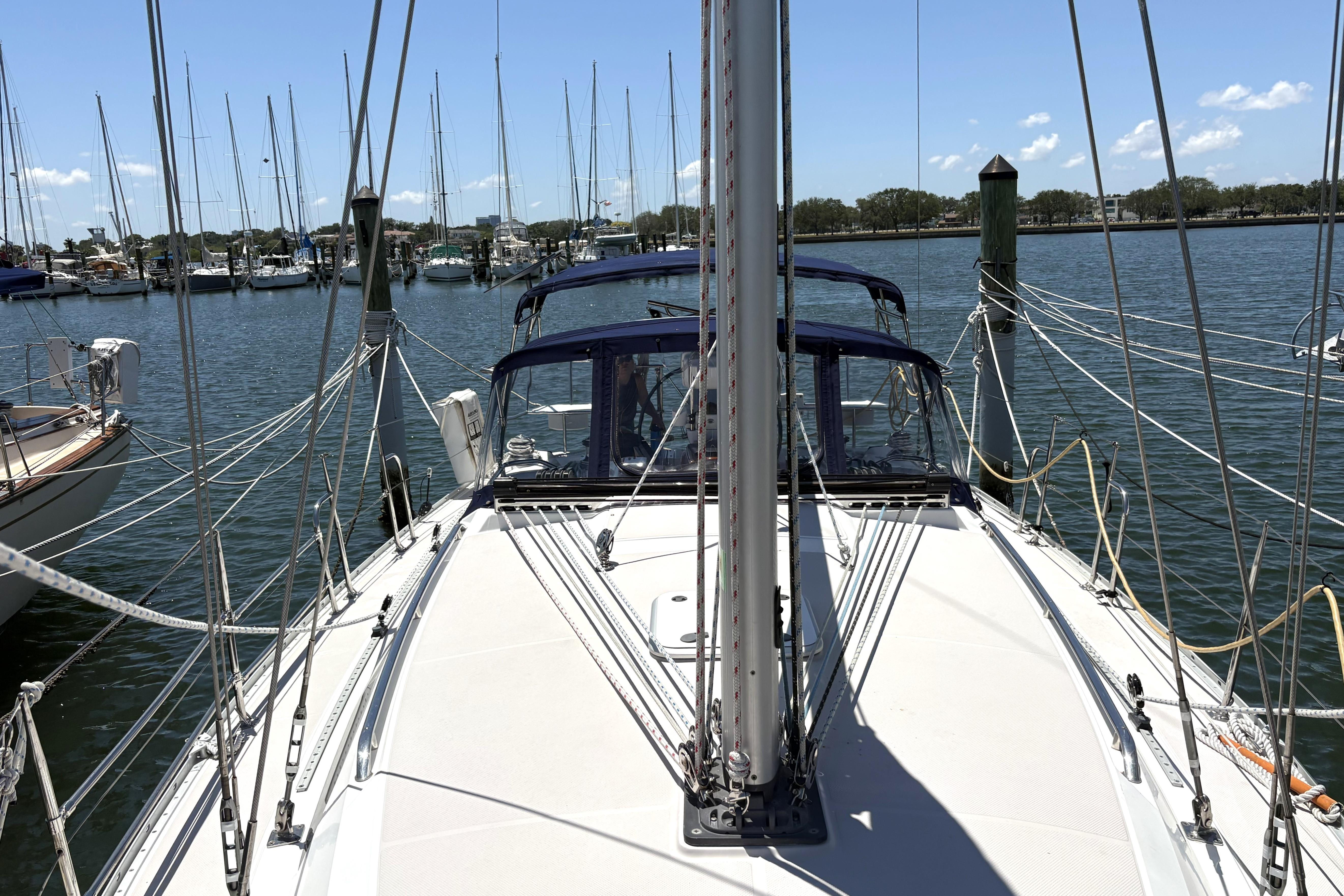 Sailboat Catalina 355, 2011 model, docked at marina with clear blue sky.
