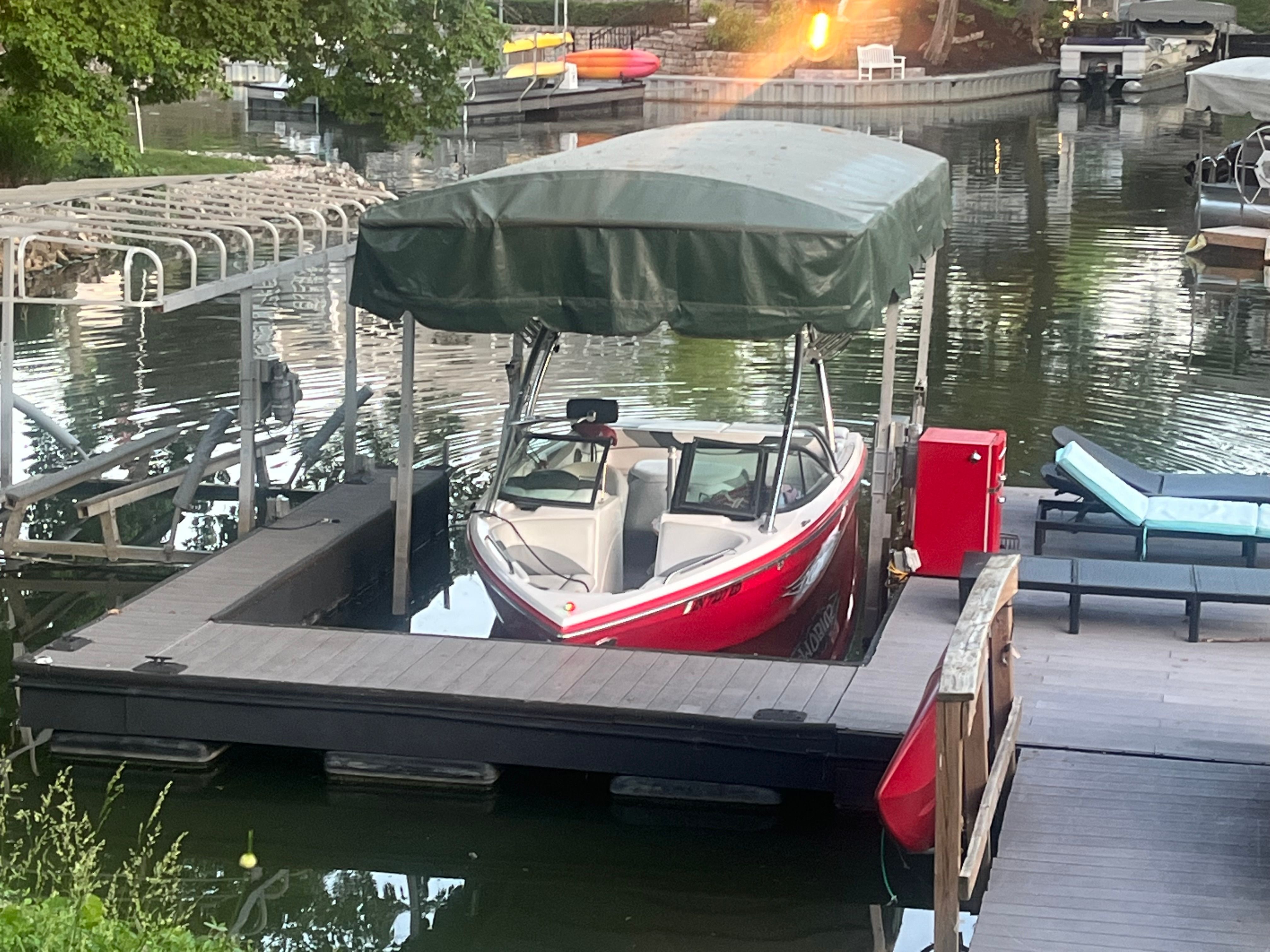 2008 Moomba Mobius LS boat on a covered dock.
